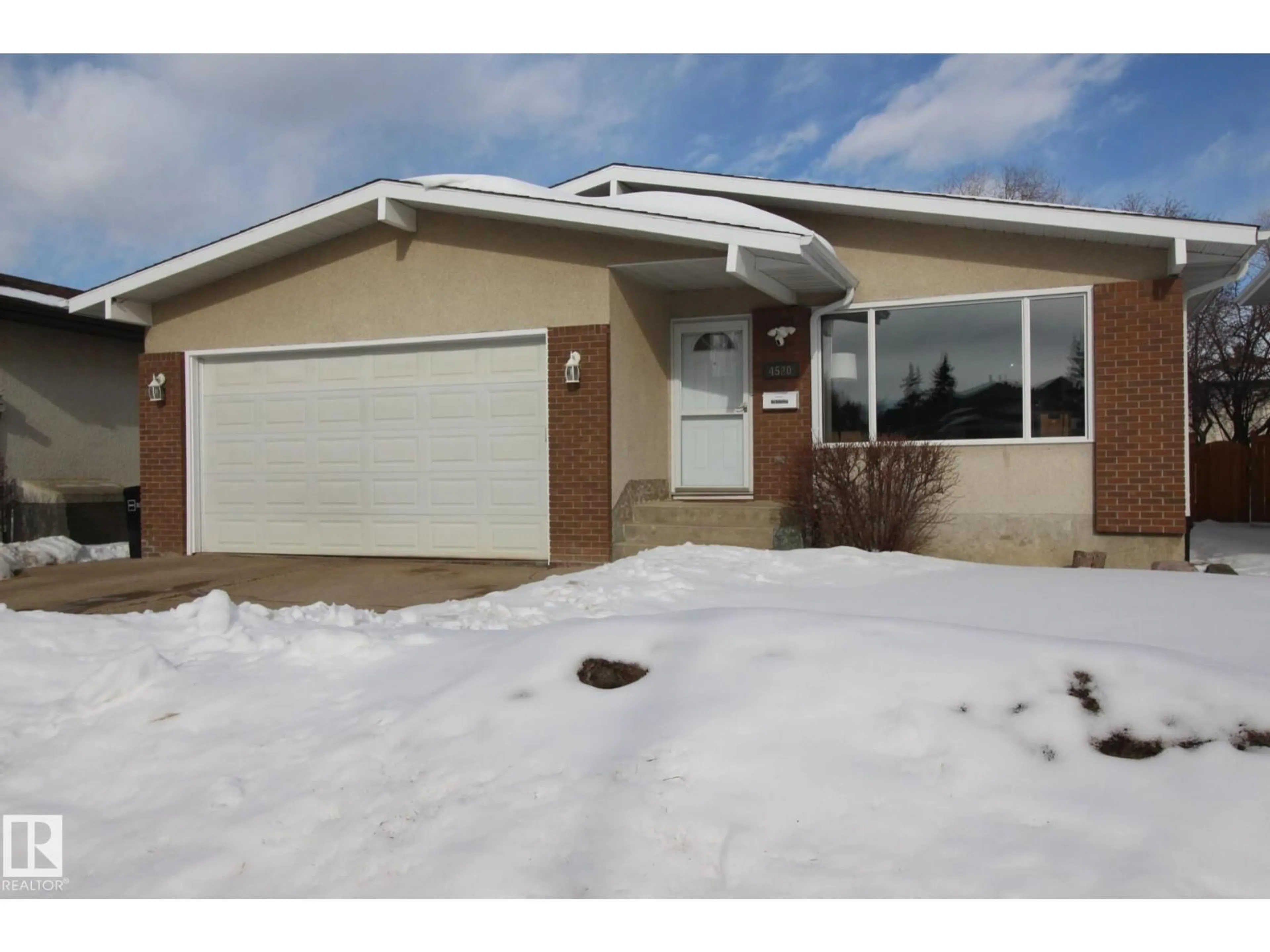 Home with vinyl exterior material, street for 4520 20A AV, Edmonton Alberta T6L2Z5