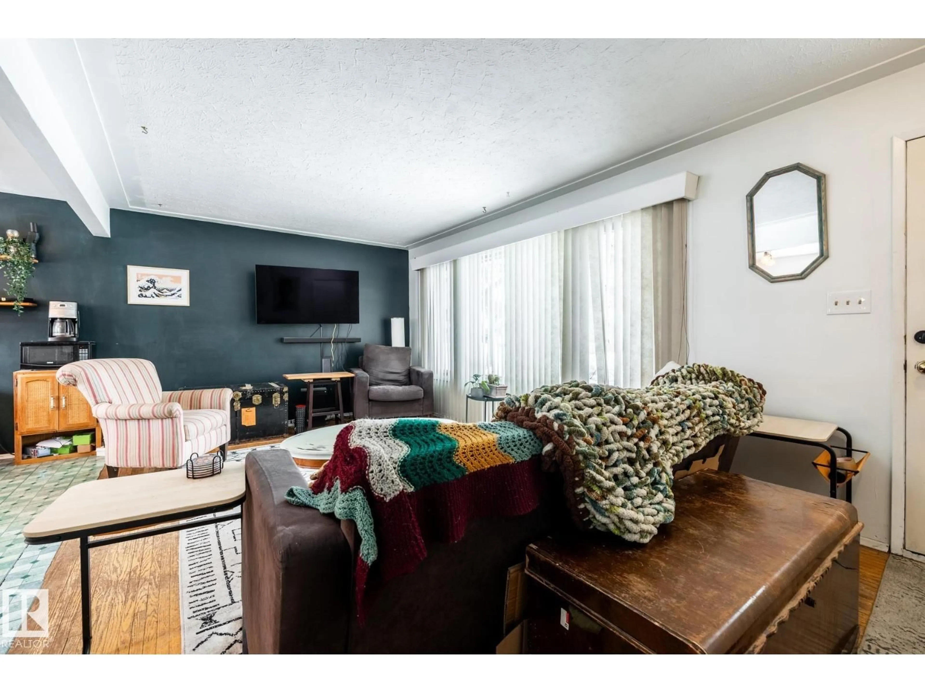 Living room with furniture, wood/laminate floor for NW - 12231 47 ST, Edmonton Alberta T5W2X6