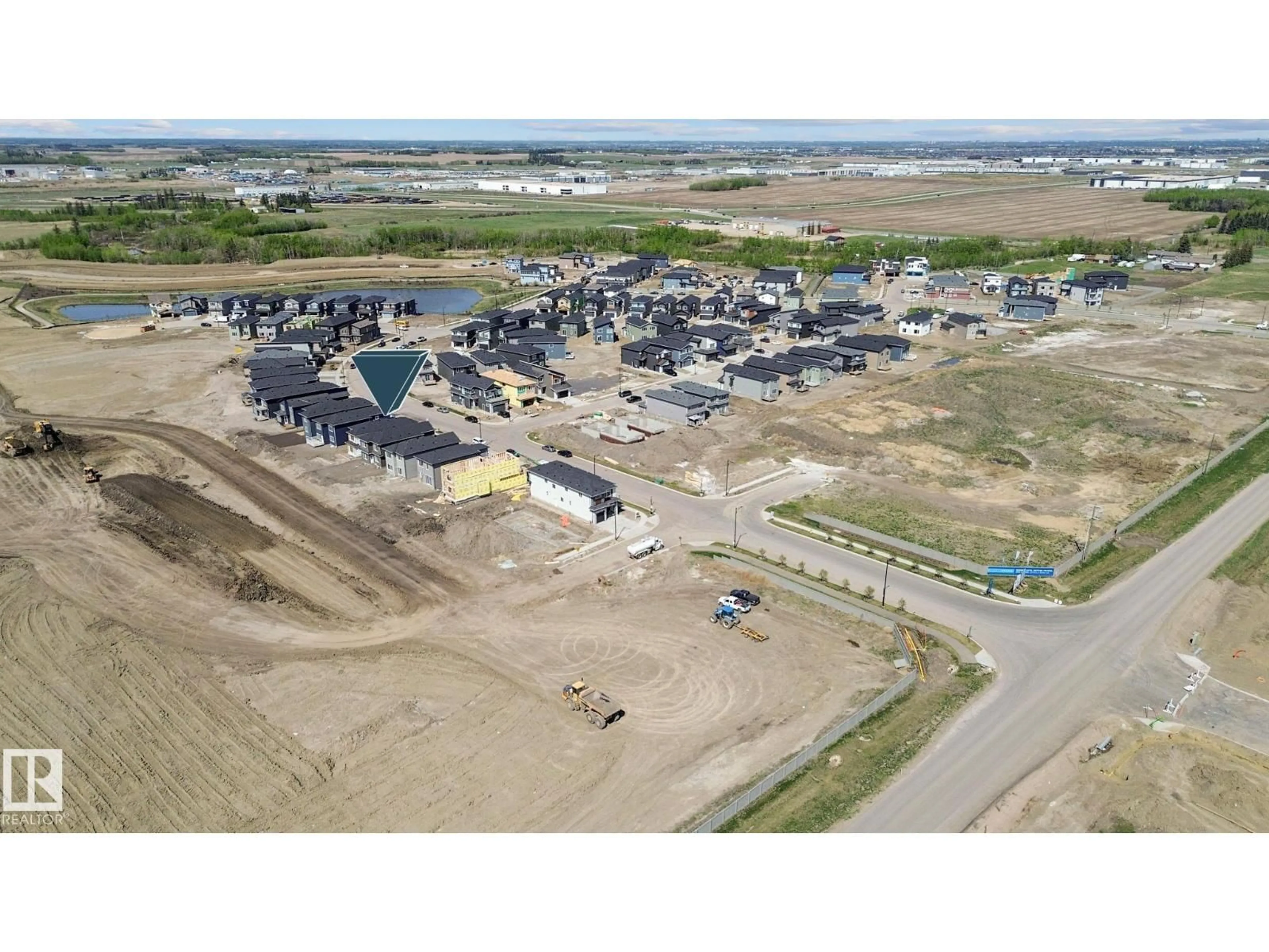 A pic from outside/outdoor area/front of a property/back of a property/a pic from drone, unknown for 1915 63 AV, Rural Leduc County Alberta T4X3C9
