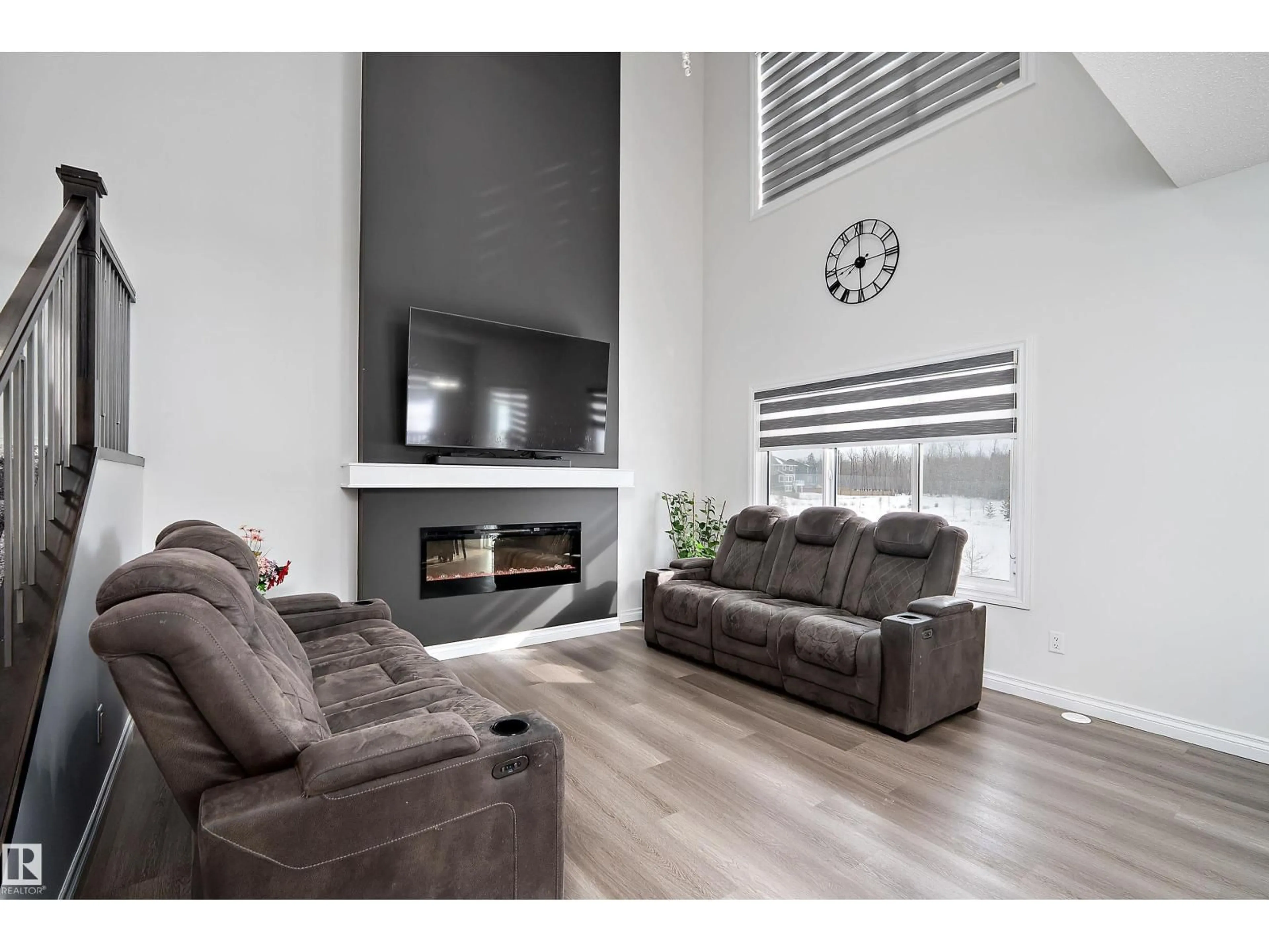 Living room with furniture, wood/laminate floor for SW - 5211 23A AV, Edmonton Alberta T6X2X3