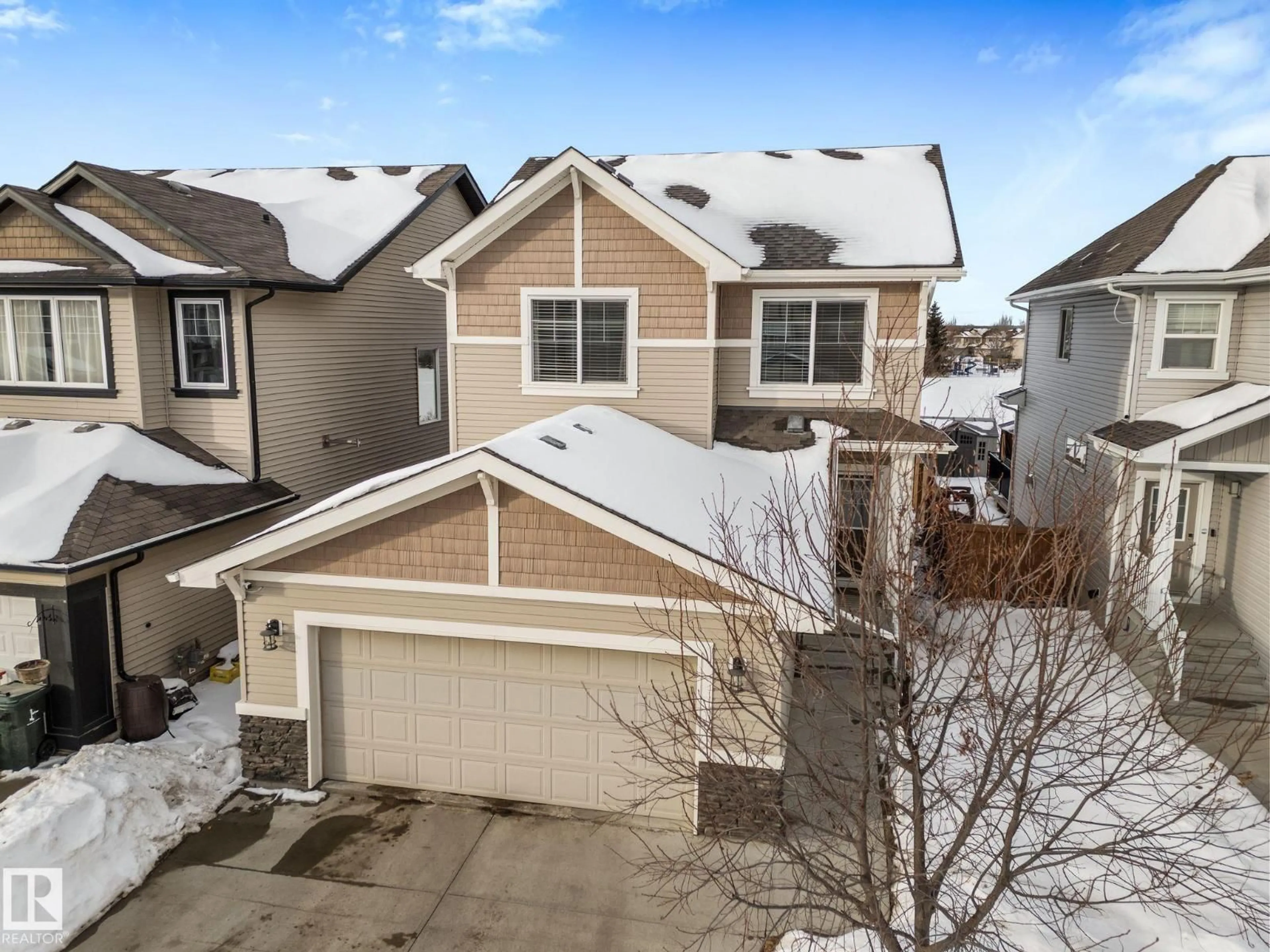 A pic from outside/outdoor area/front of a property/back of a property/a pic from drone, street for 1043 SOUTH CREEK WD, Stony Plain Alberta T7Z0C9