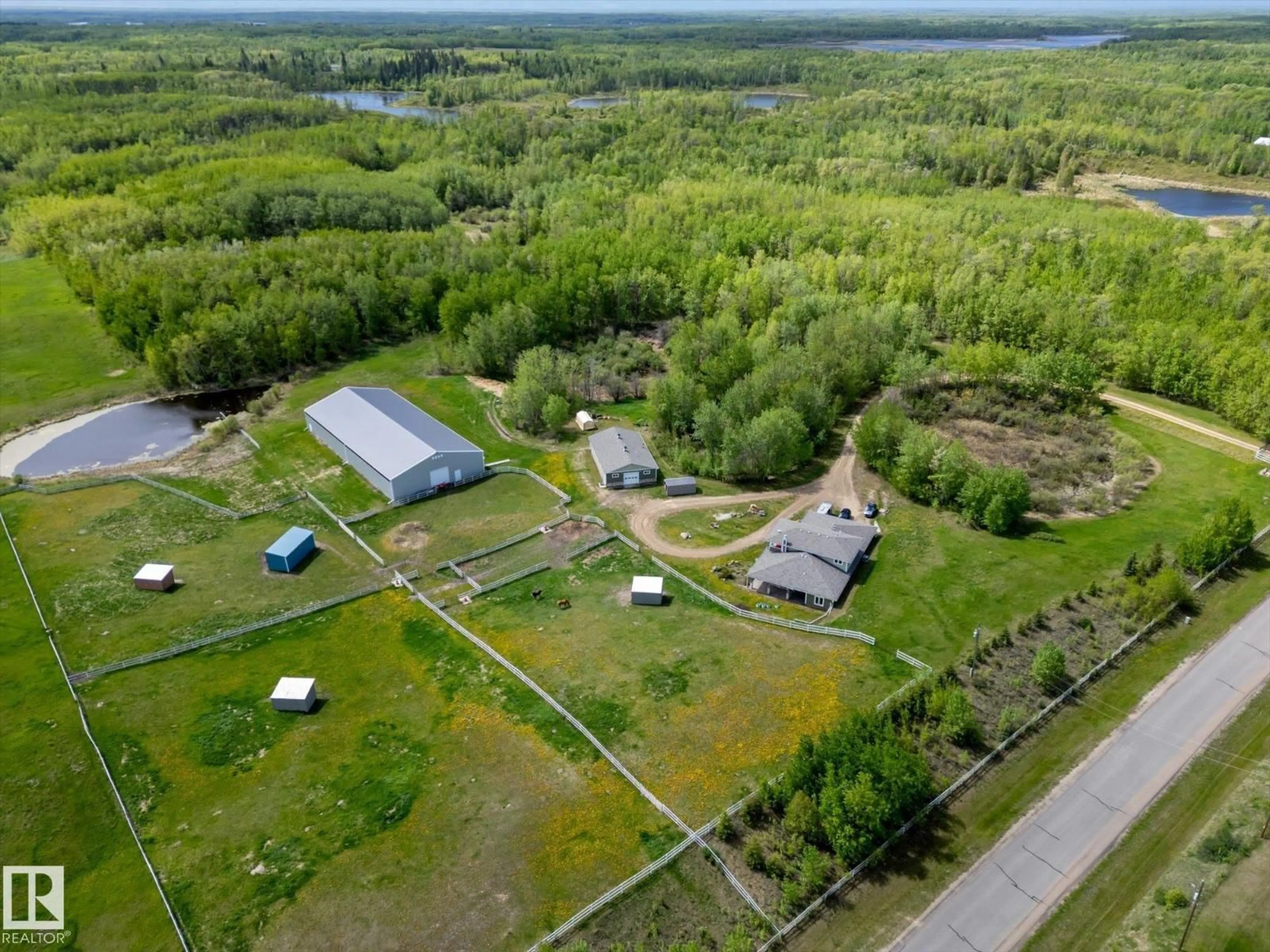 A pic from outside/outdoor area/front of a property/back of a property/a pic from drone, unknown for 21031 TWP ROAD 530, Rural Strathcona County Alberta T8G2C7
