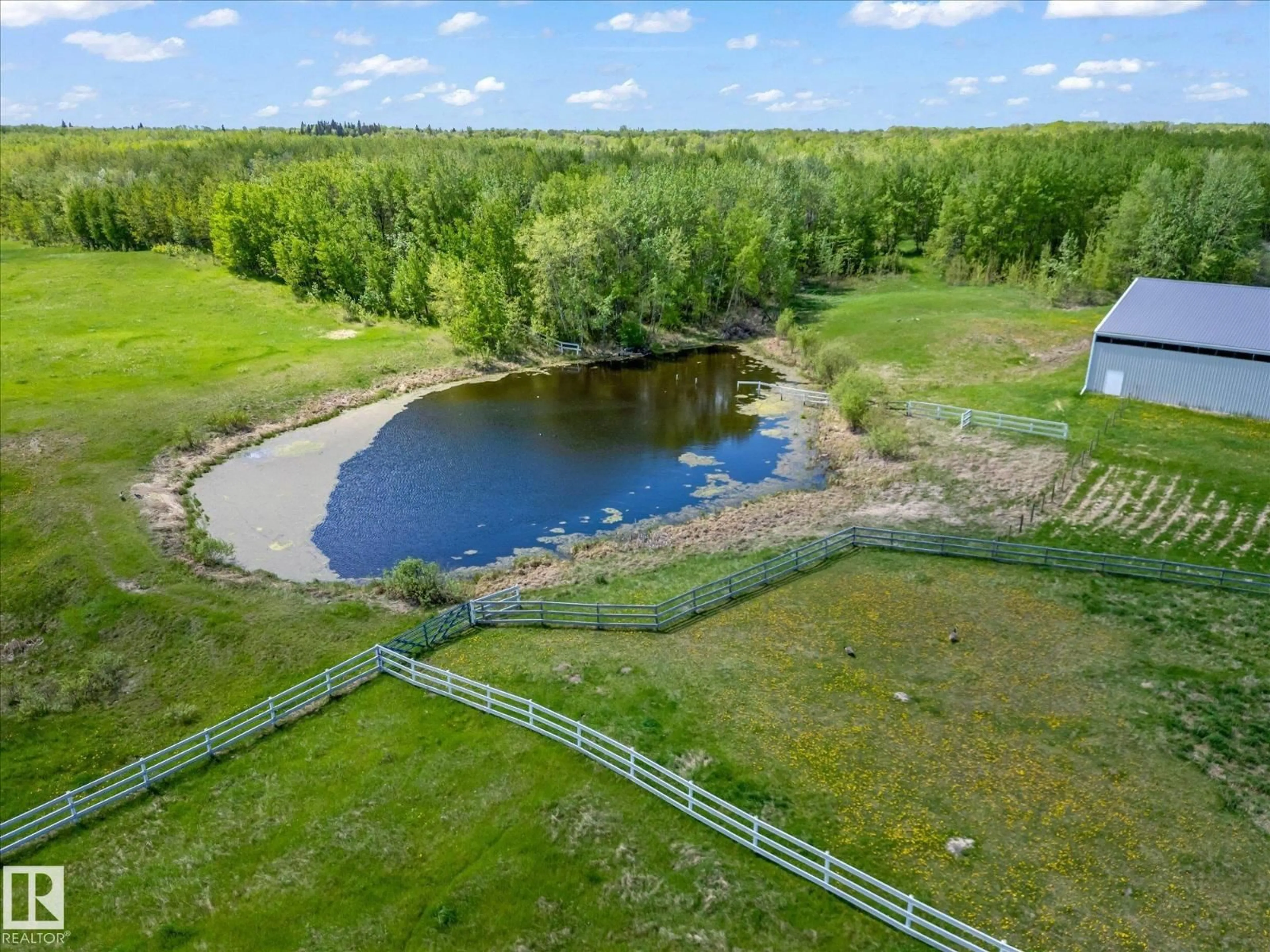 A pic from outside/outdoor area/front of a property/back of a property/a pic from drone, water/lake/river/ocean view for 21031 TWP ROAD 530, Rural Strathcona County Alberta T8G2C7