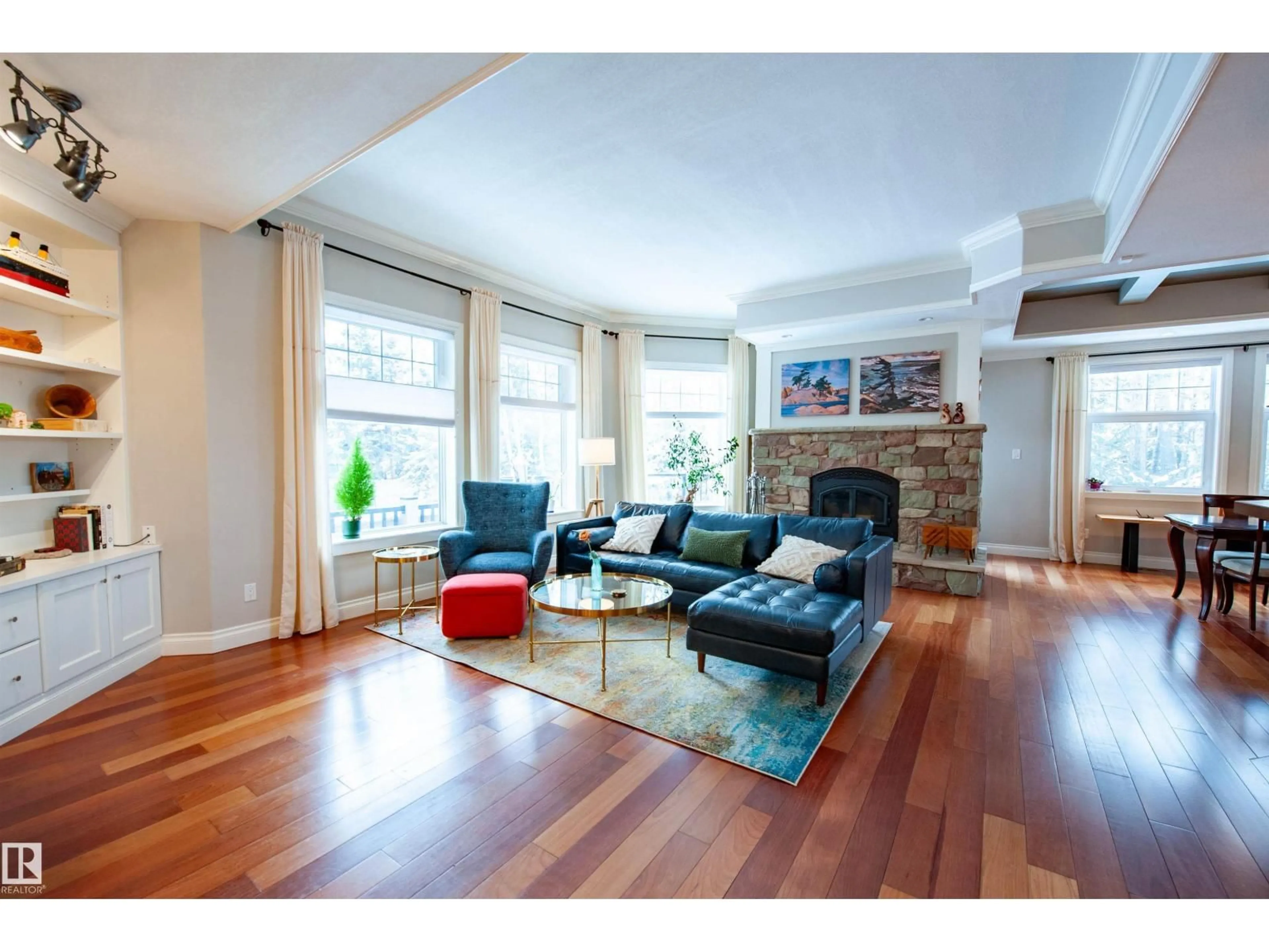 Living room with furniture, wood/laminate floor for 47 RIVER HEIGHTS DR, Edmonton Alberta T6M2R1