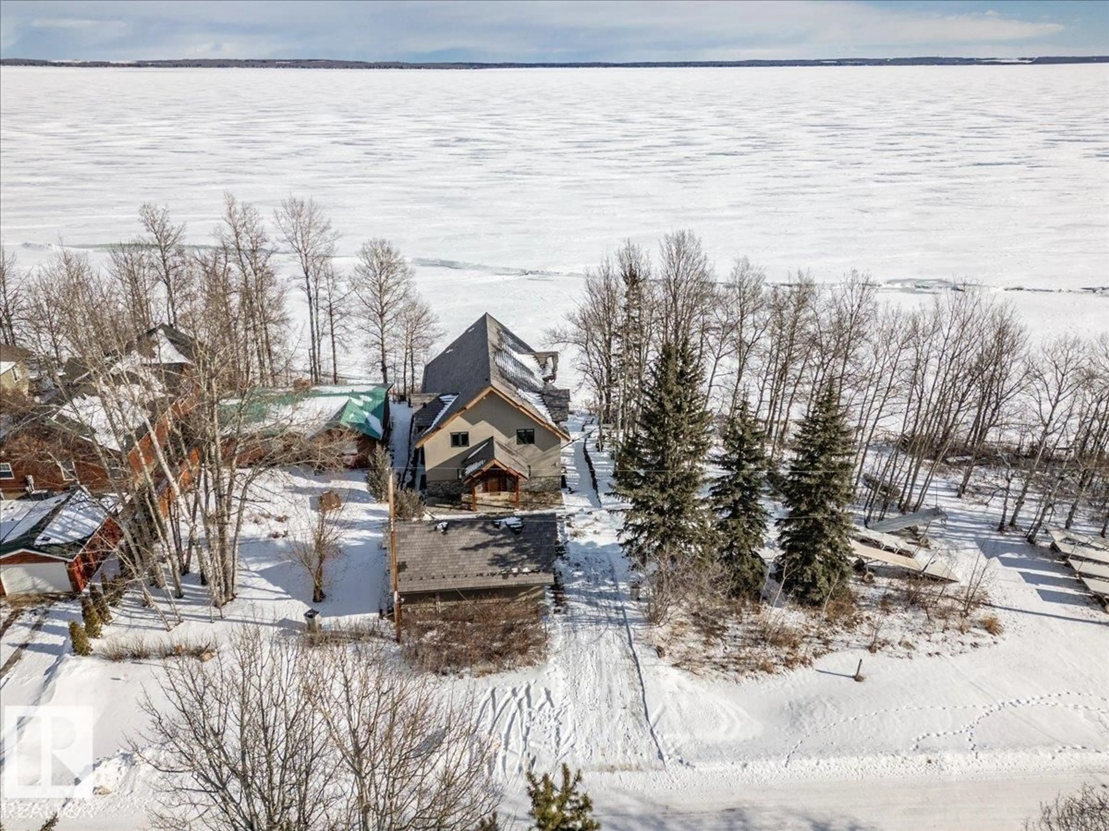 A pic from outside/outdoor area/front of a property/back of a property/a pic from drone, water/lake/river/ocean view for 451 POPLAR BAY DR, Rural Wetaskiwin County Alberta T0C1X0