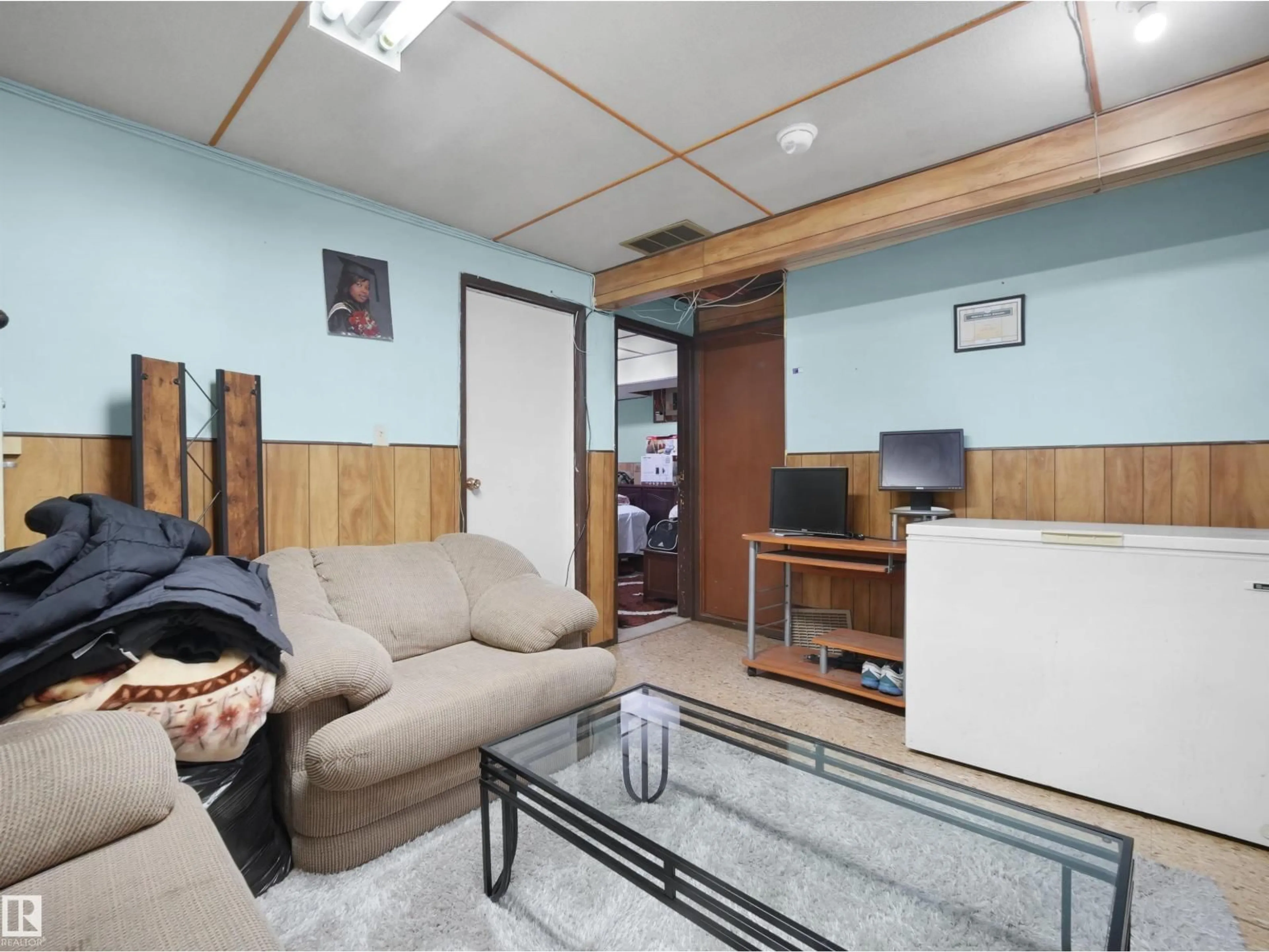 Living room with furniture, wood/laminate floor for 17122 96 ST NW, Edmonton Alberta T5Z1Z7