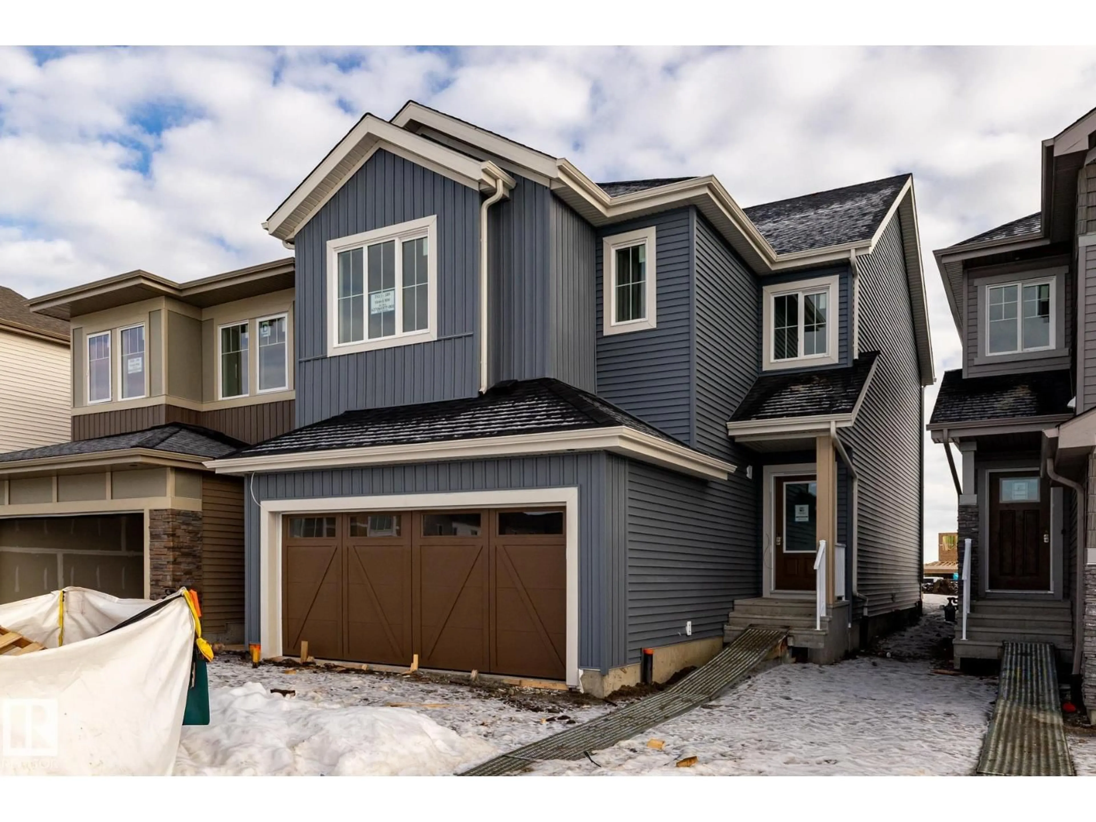 Home with vinyl exterior material, street for NW - 2511 189 ST, Edmonton Alberta T6M3H9