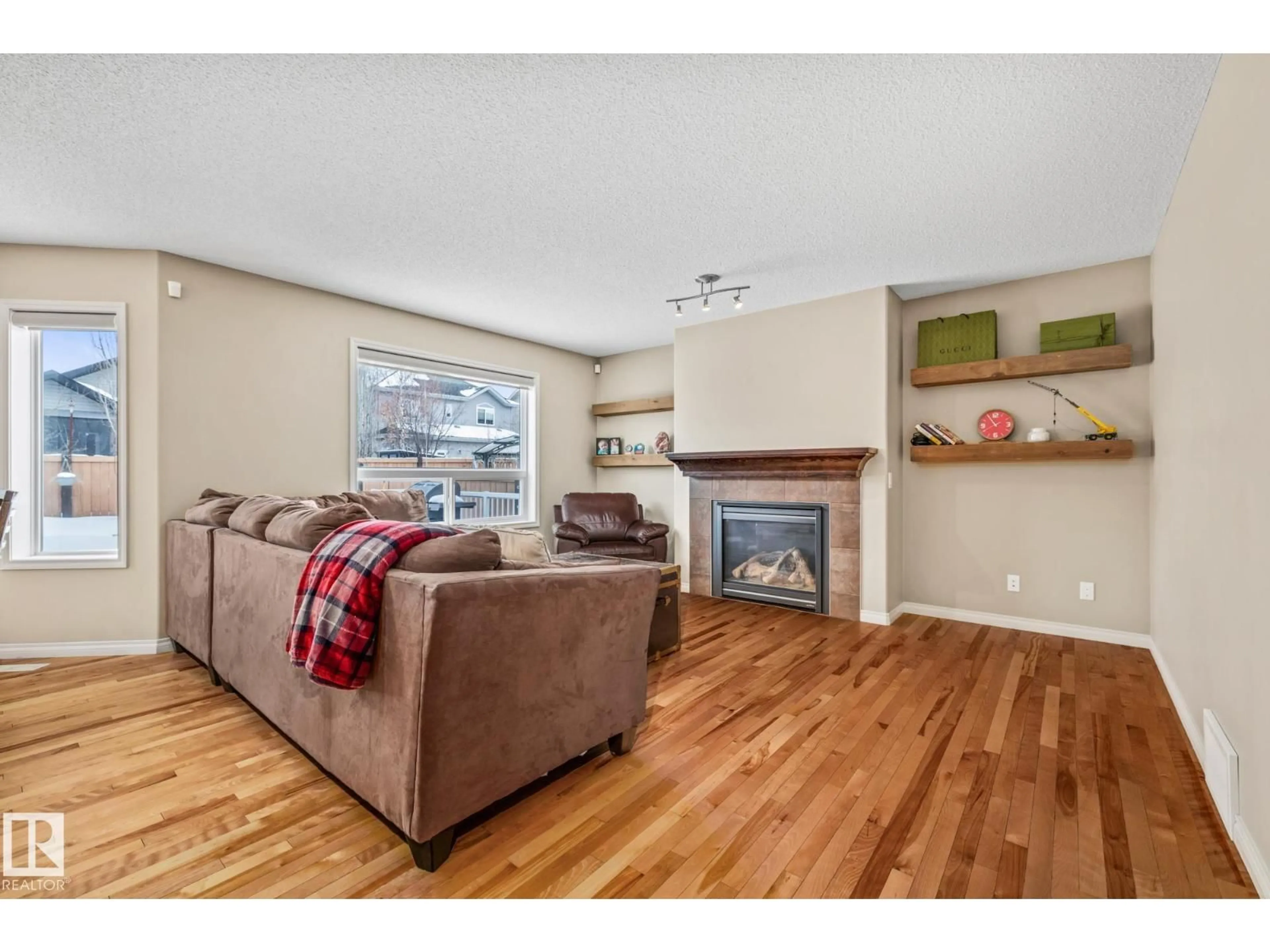 Living room with furniture, wood/laminate floor for 33 NEWGATE WY, St. Albert Alberta T8N4C5