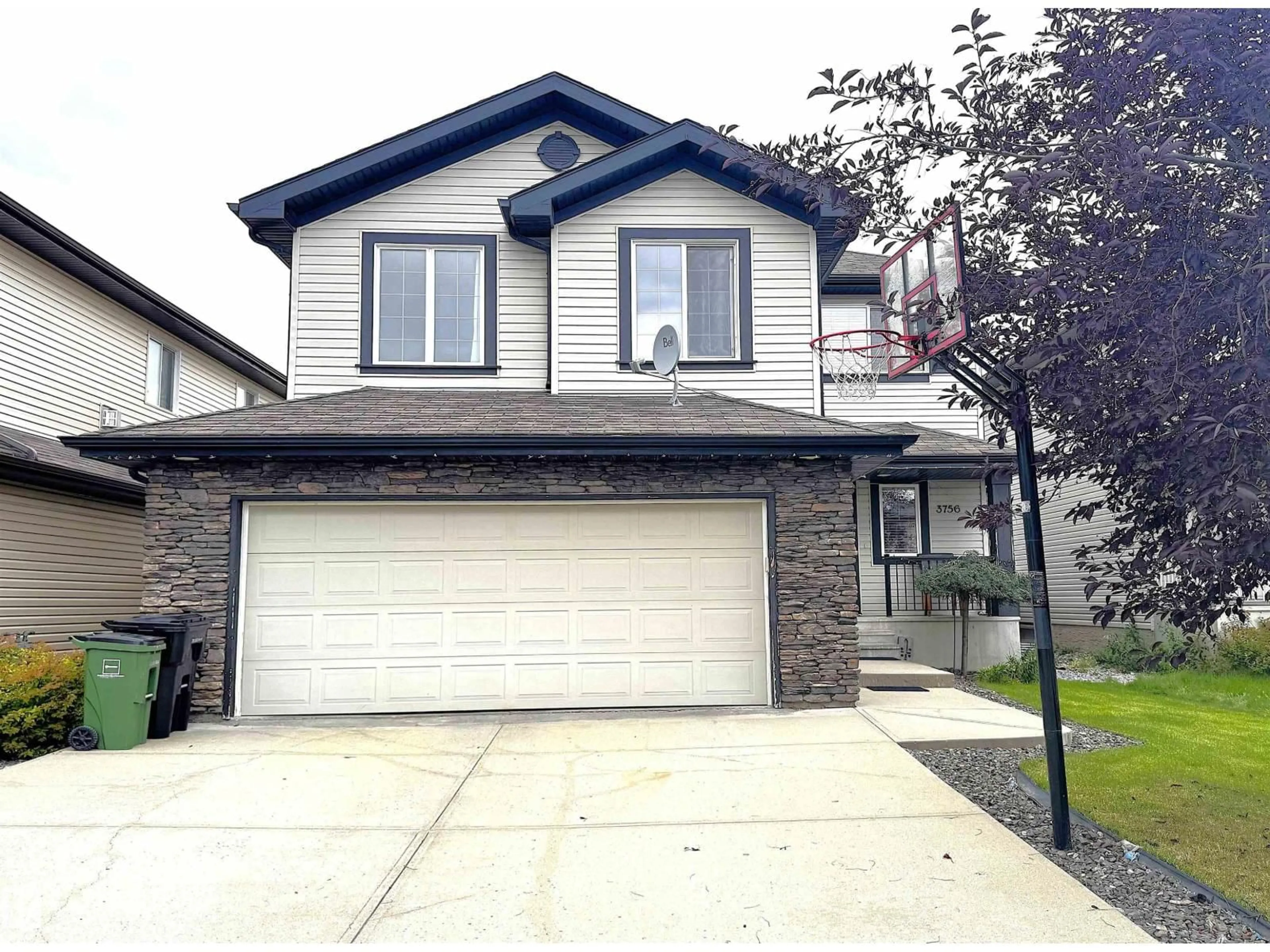 Home with vinyl exterior material, street for NW - 3756 13 ST, Edmonton Alberta T6T0E5