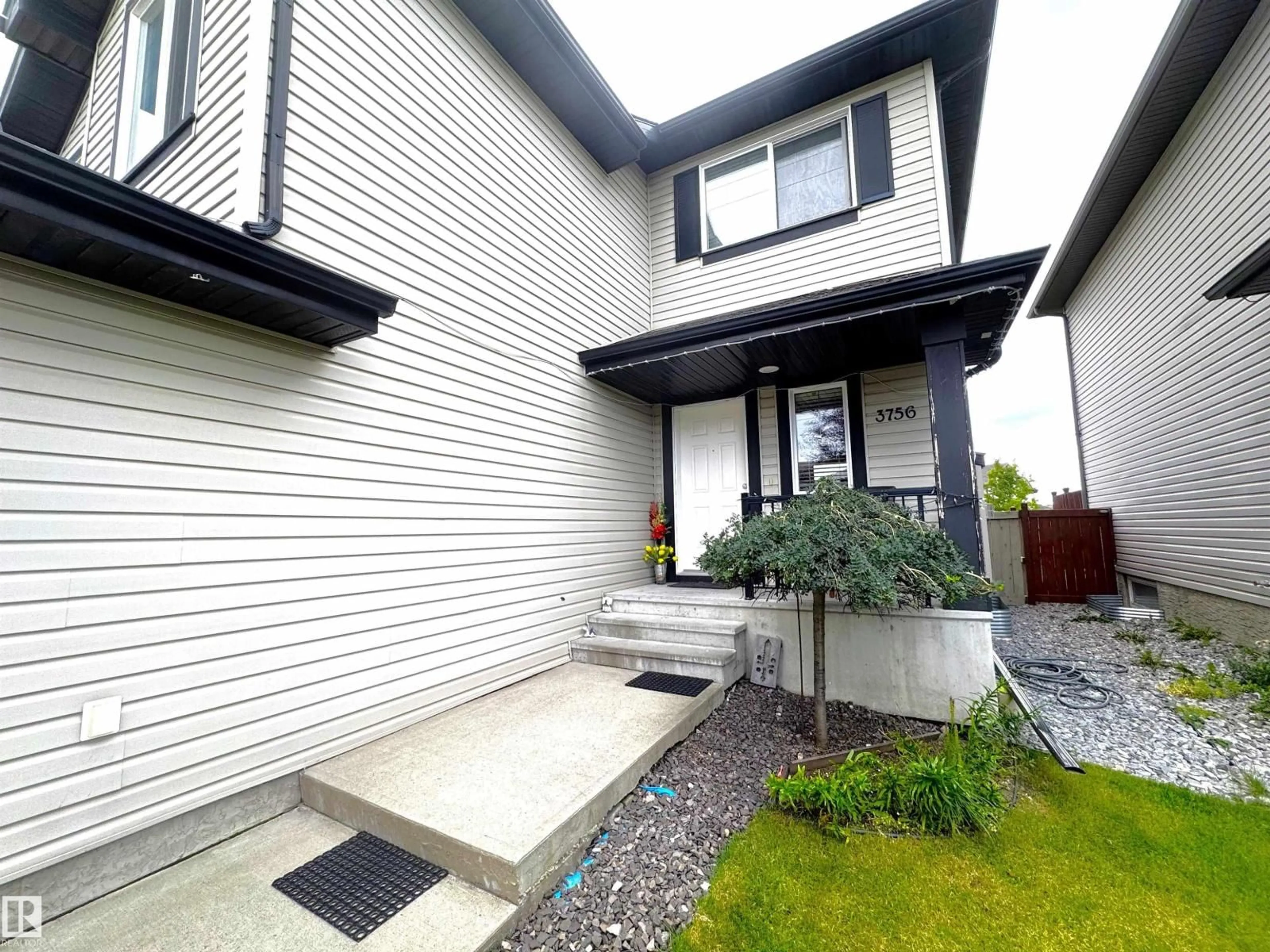 Home with vinyl exterior material, street for NW - 3756 13 ST, Edmonton Alberta T6T0E5