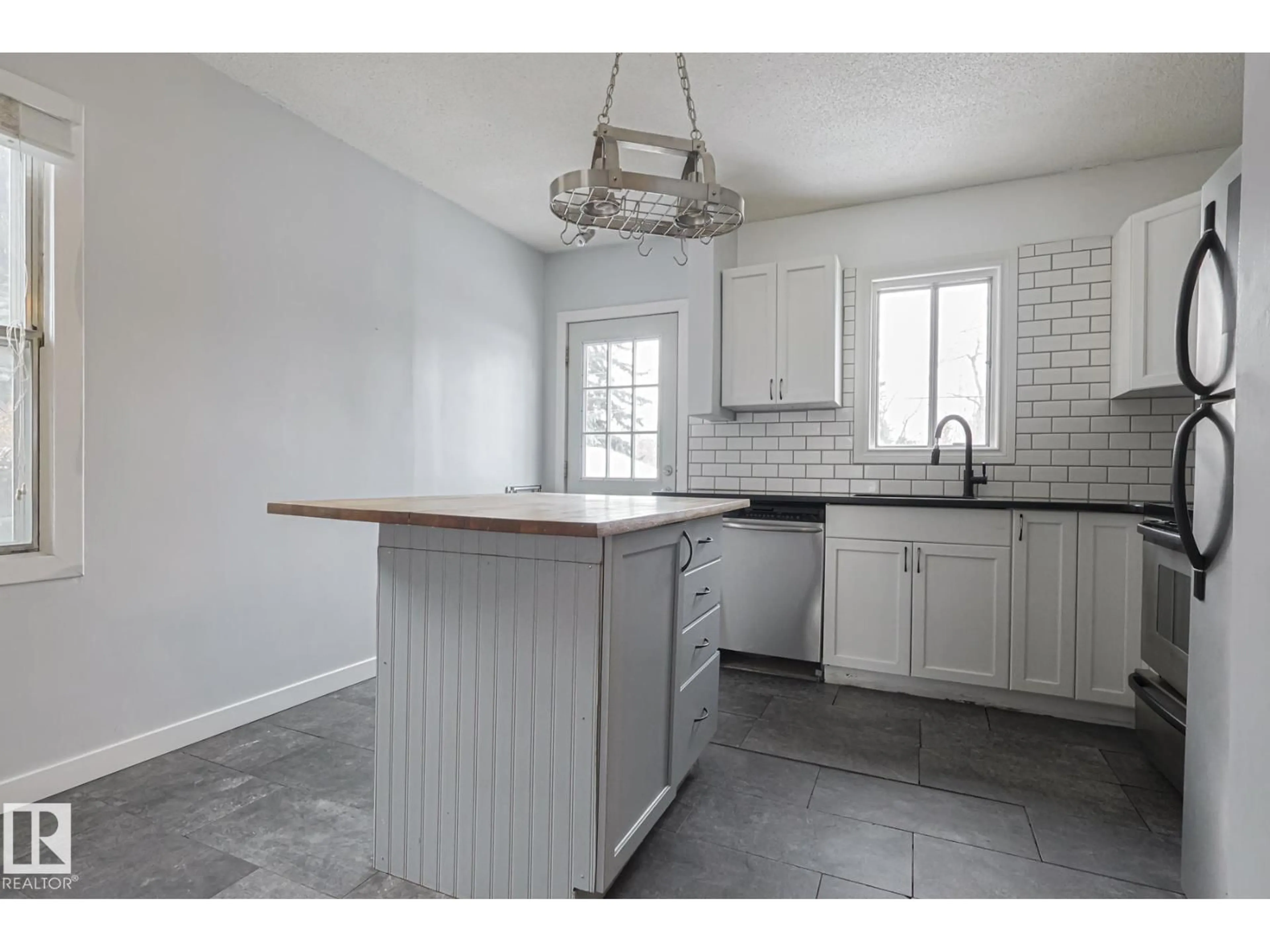 Open concept kitchen, unknown for 13519 107A AV, Edmonton Alberta T5M2A6