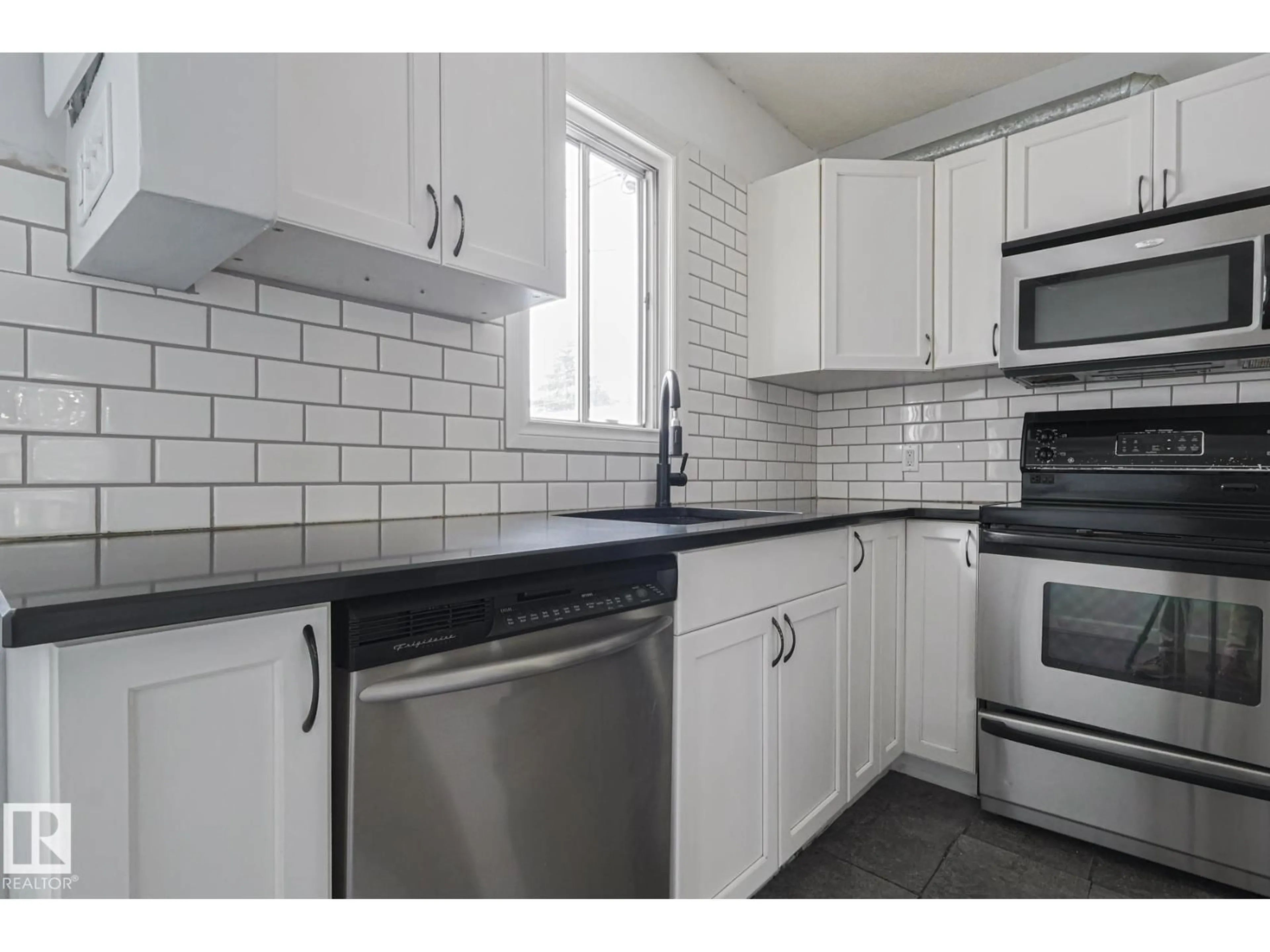 Standard kitchen, ceramic/tile floor for 13519 107A AV, Edmonton Alberta T5M2A6