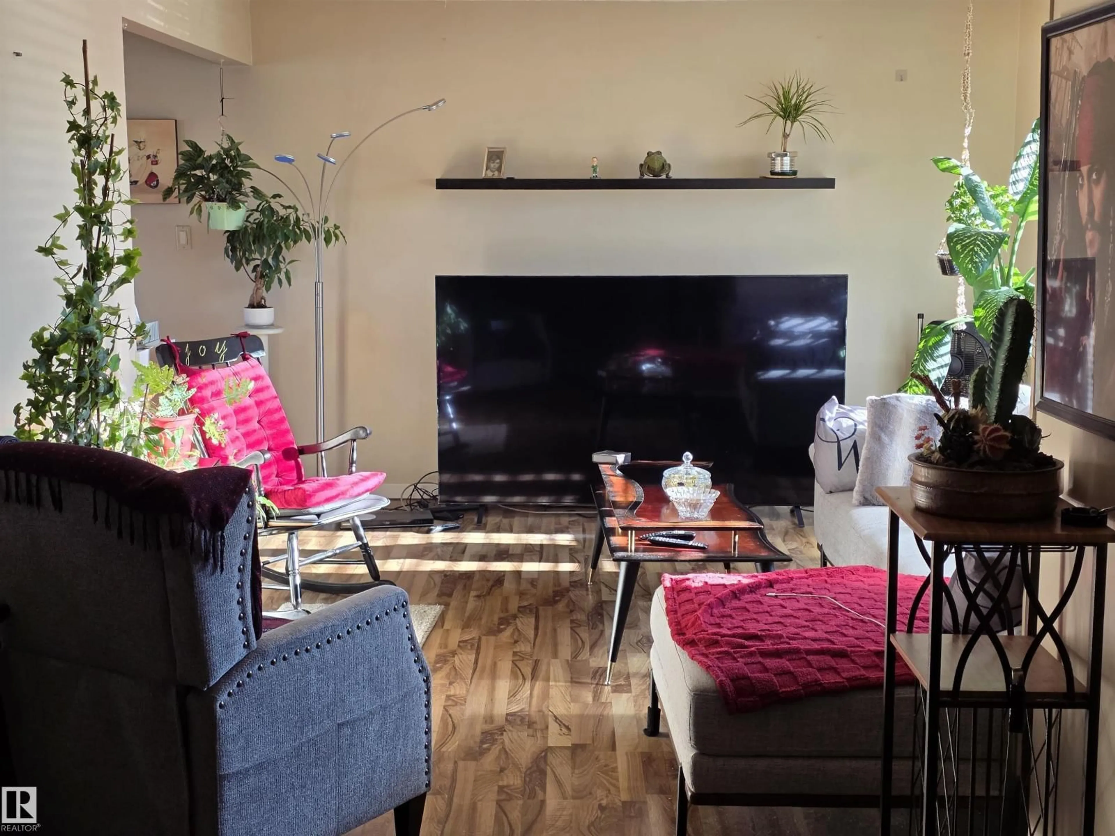 Living room with furniture, wood/laminate floor for NW - 16142 110B AV, Edmonton Alberta T5P4E6