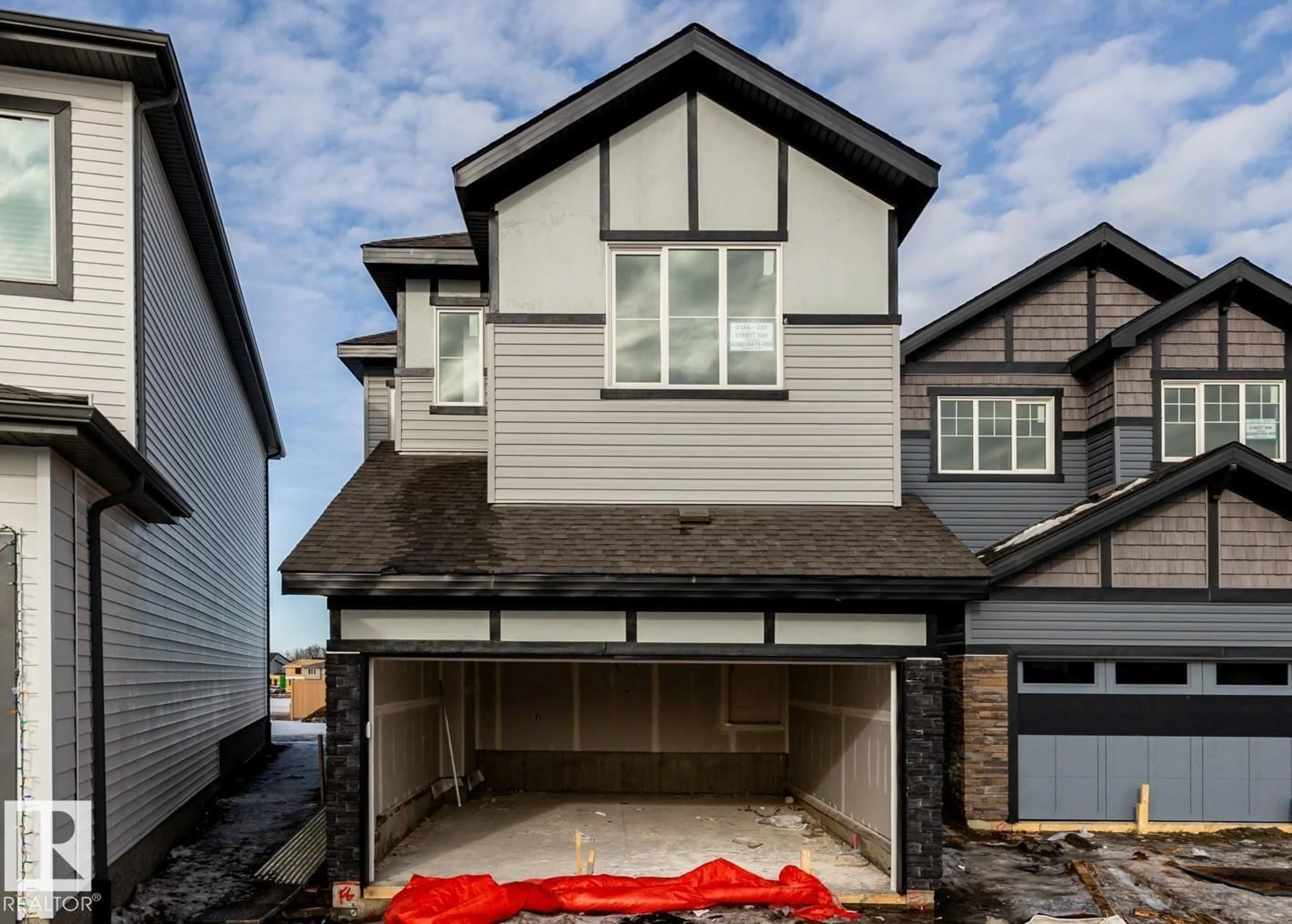 Home with vinyl exterior material, street for NW - 2144 210 ST, Edmonton Alberta T6M3H7