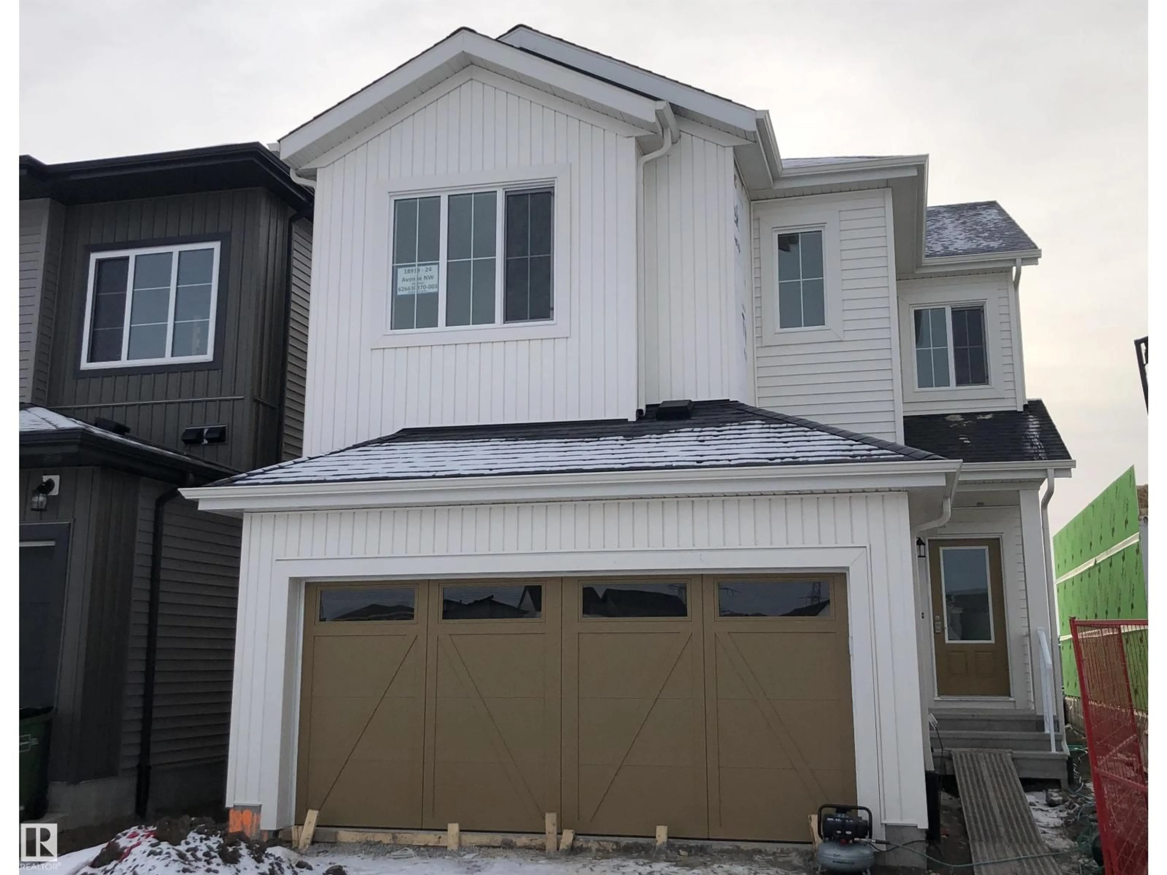 Home with vinyl exterior material, street for 18919 24 AV, Edmonton Alberta T6M3H9