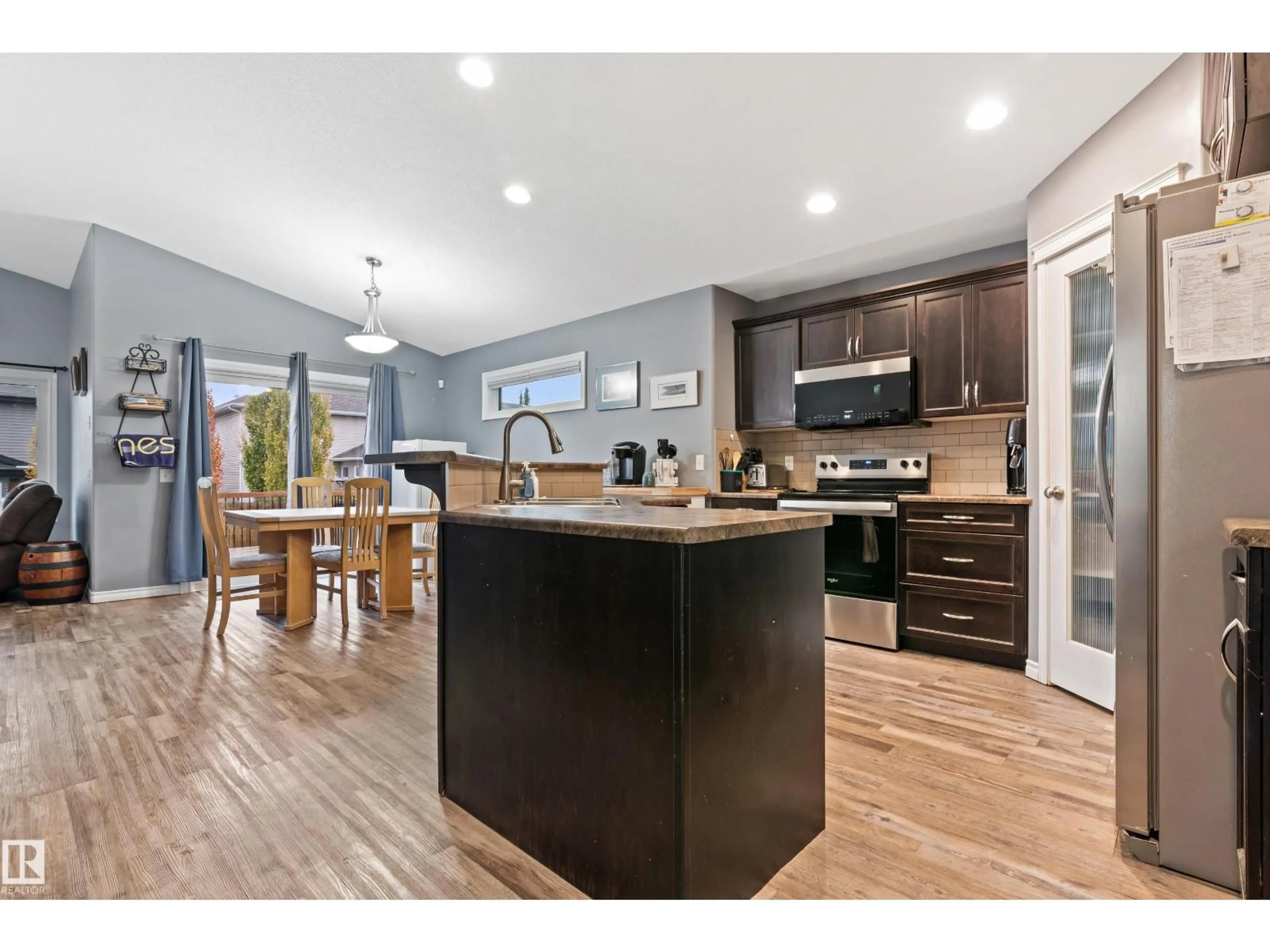 Open concept kitchen, wood/laminate floor for 6 SEQUOIA BN, Fort Saskatchewan Alberta T8L0J2