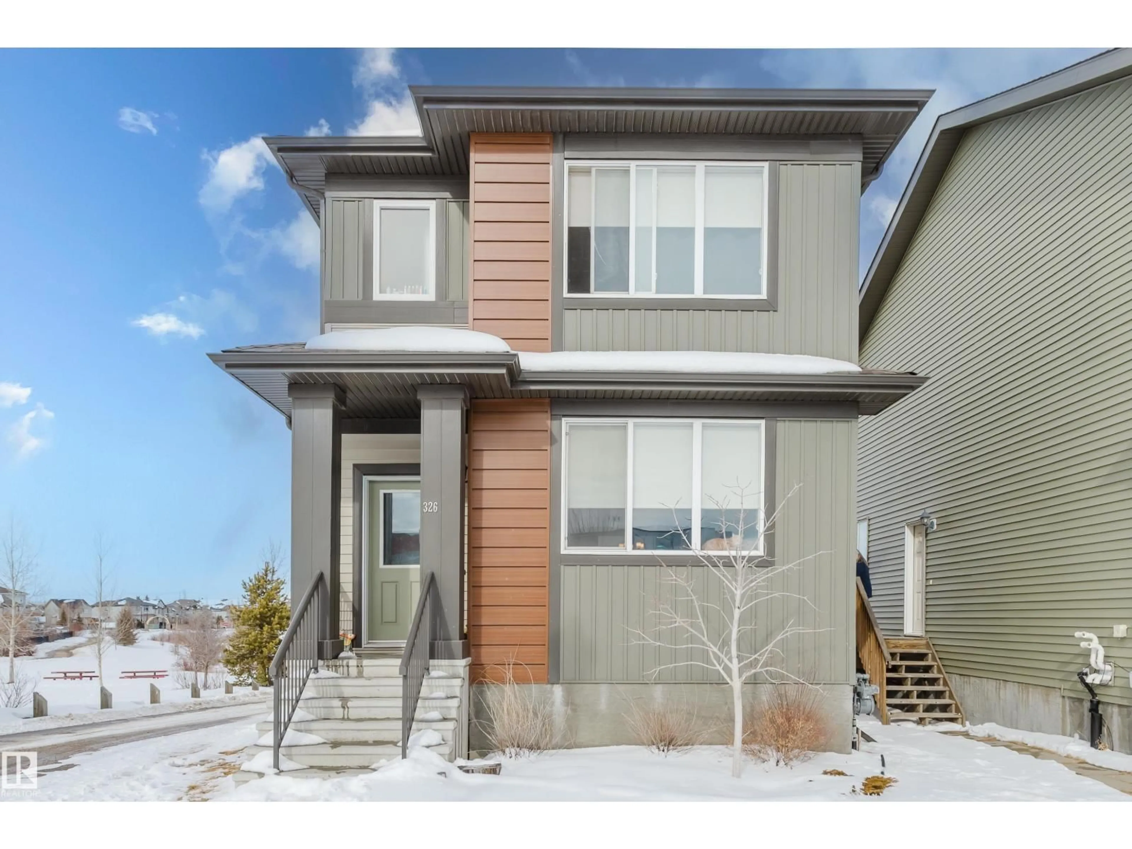 Home with vinyl exterior material, street for 326 HAVEN DR, Leduc Alberta T9E1J2