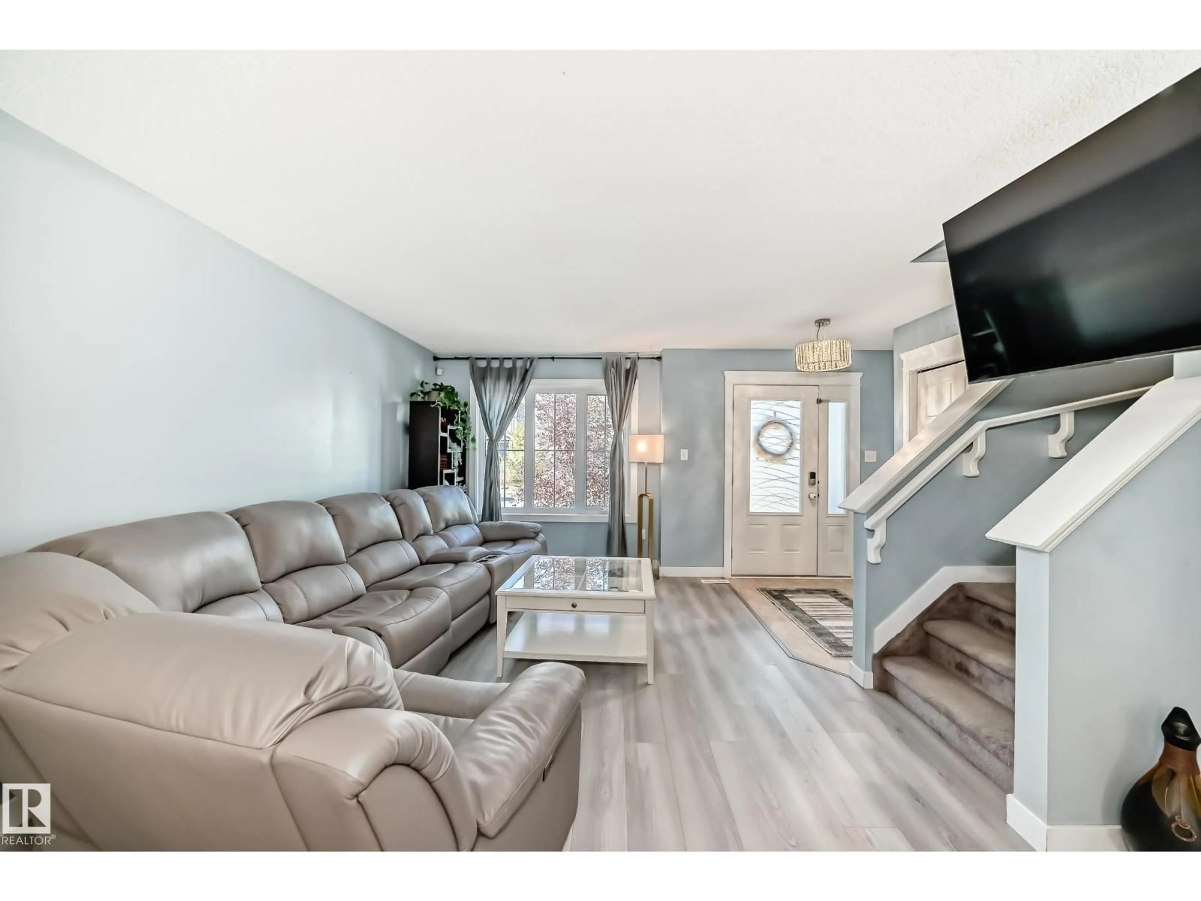 Living room with furniture, wood/laminate floor for SW - 327 DESROCHERS BV, Edmonton Alberta T6W3J1