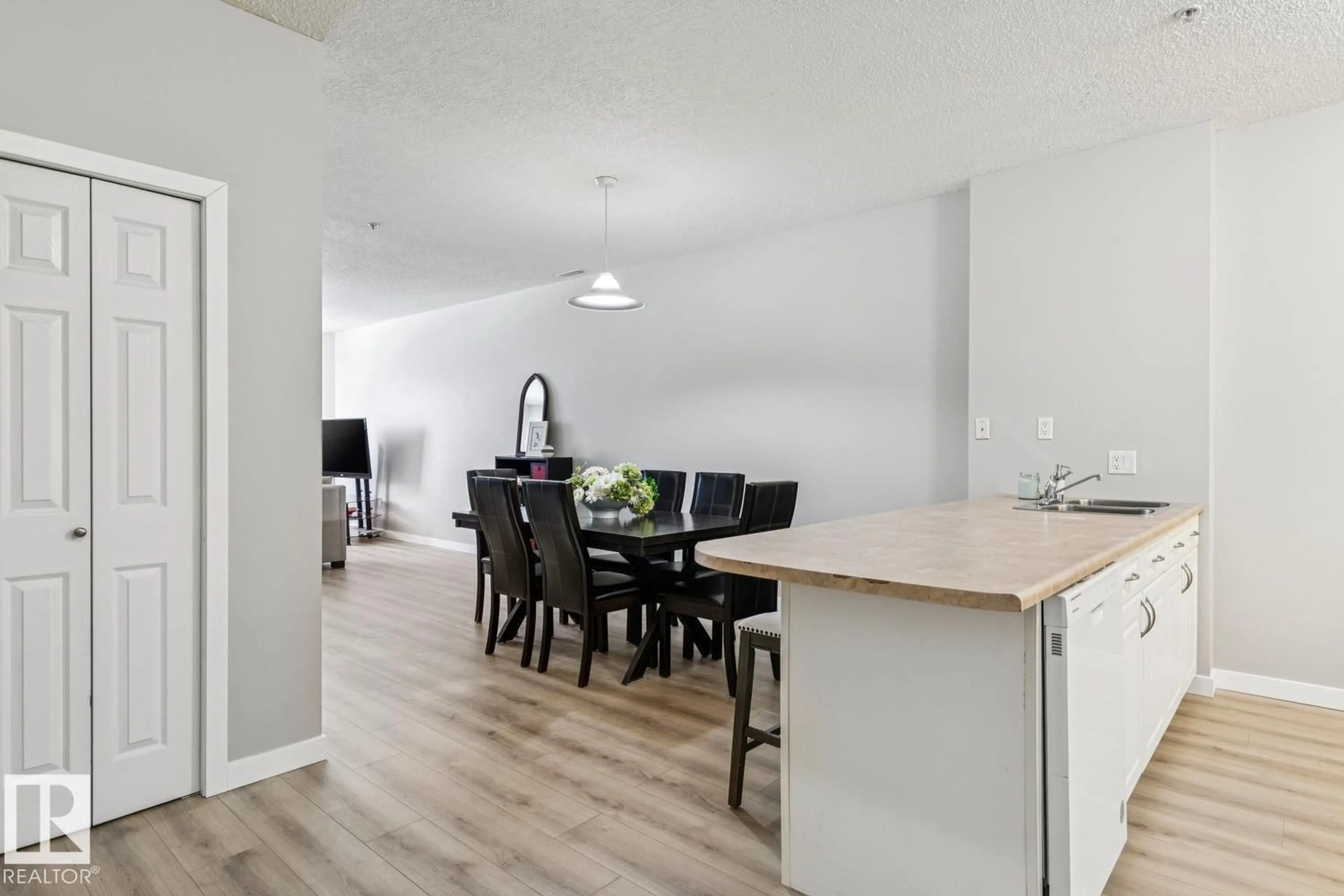 Open concept kitchen, wood/laminate floor for 402 - 9919 105 ST NW, Edmonton Alberta T5K1B1