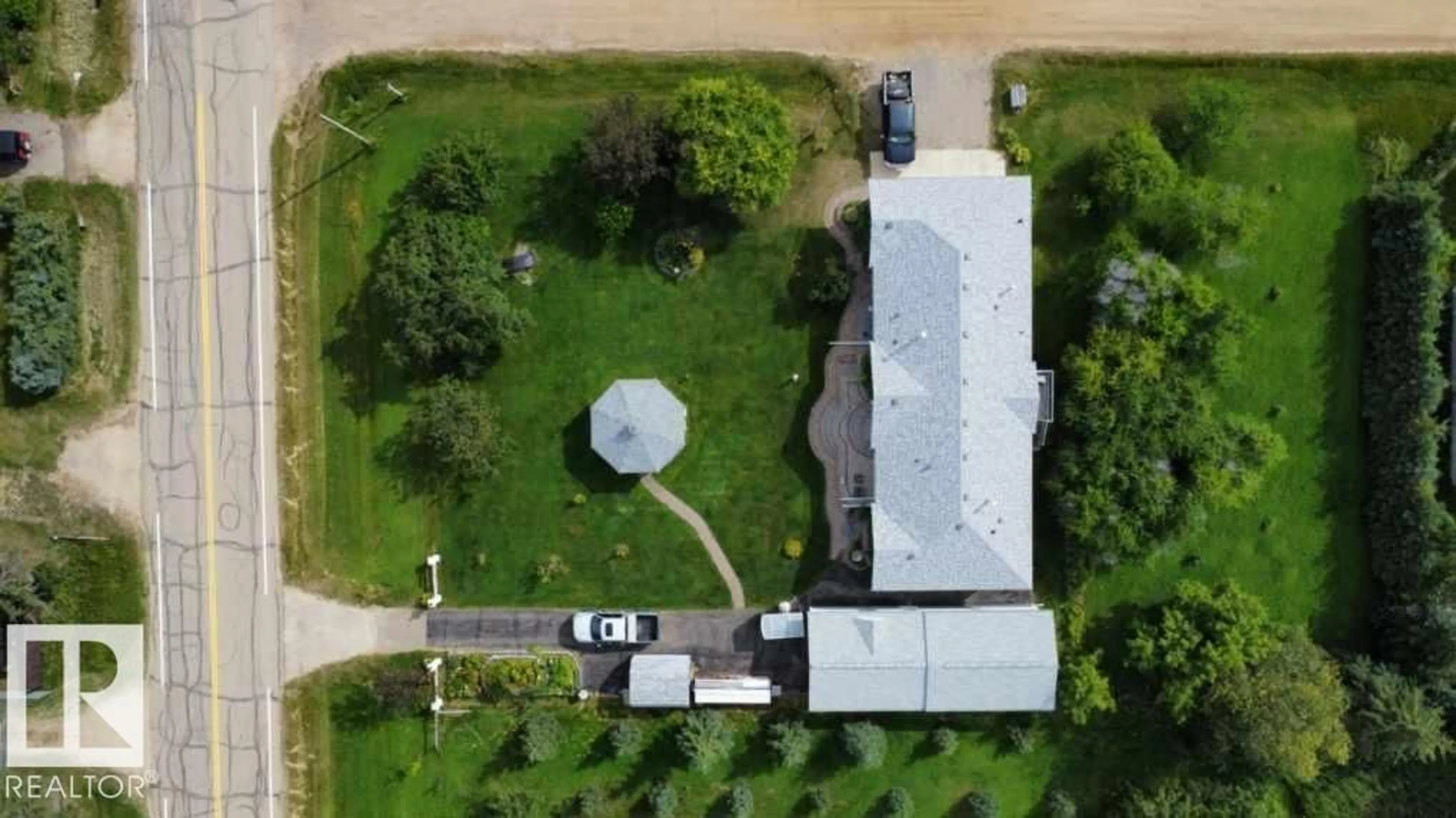 A pic from outside/outdoor area/front of a property/back of a property/a pic from drone, street for 5004 60 AV, Rural Wetaskiwin County Alberta T0C2C0