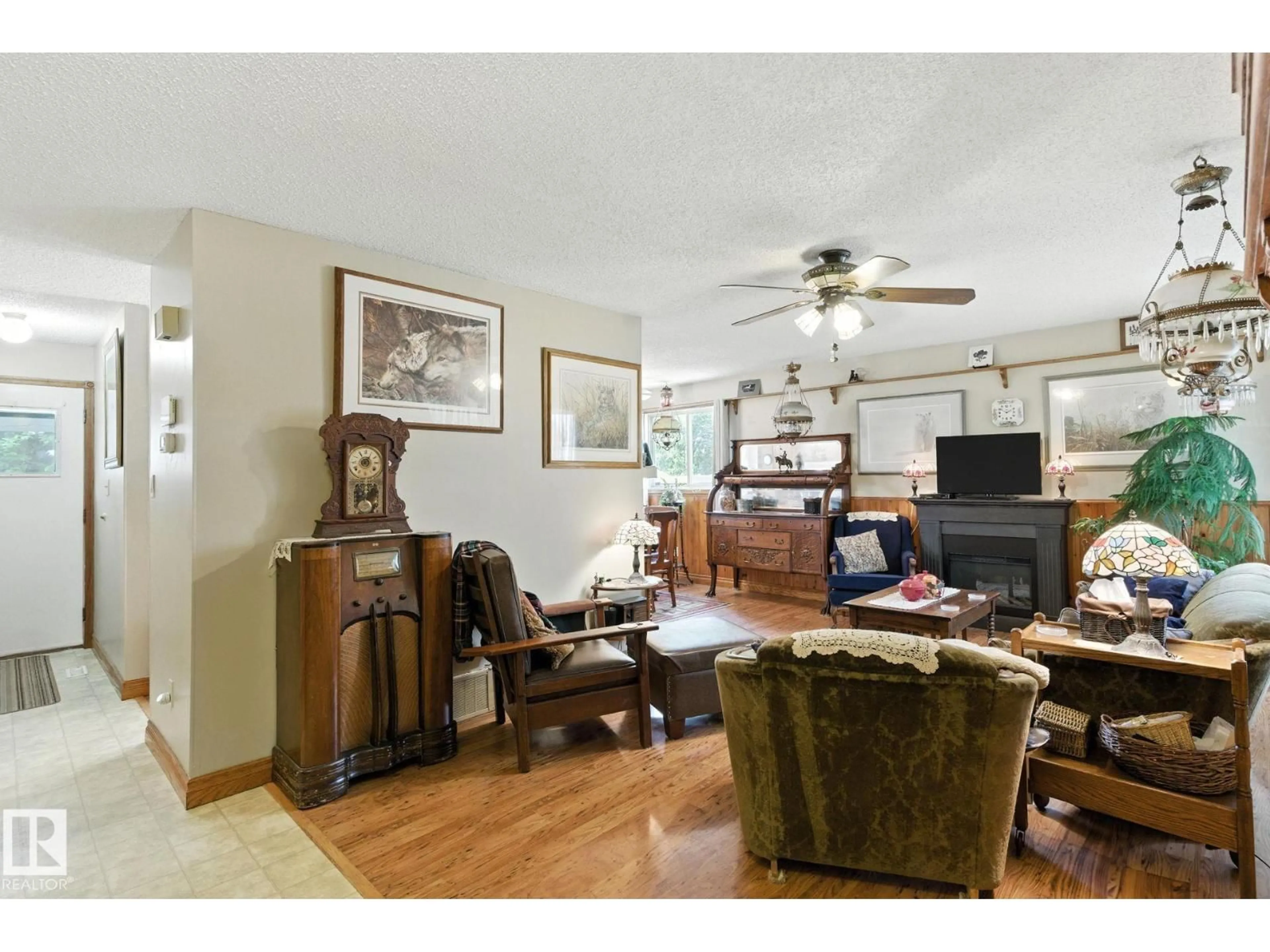 Living room with furniture, wood/laminate floor for 9608 98A ST, Morinville Alberta T8R1H2