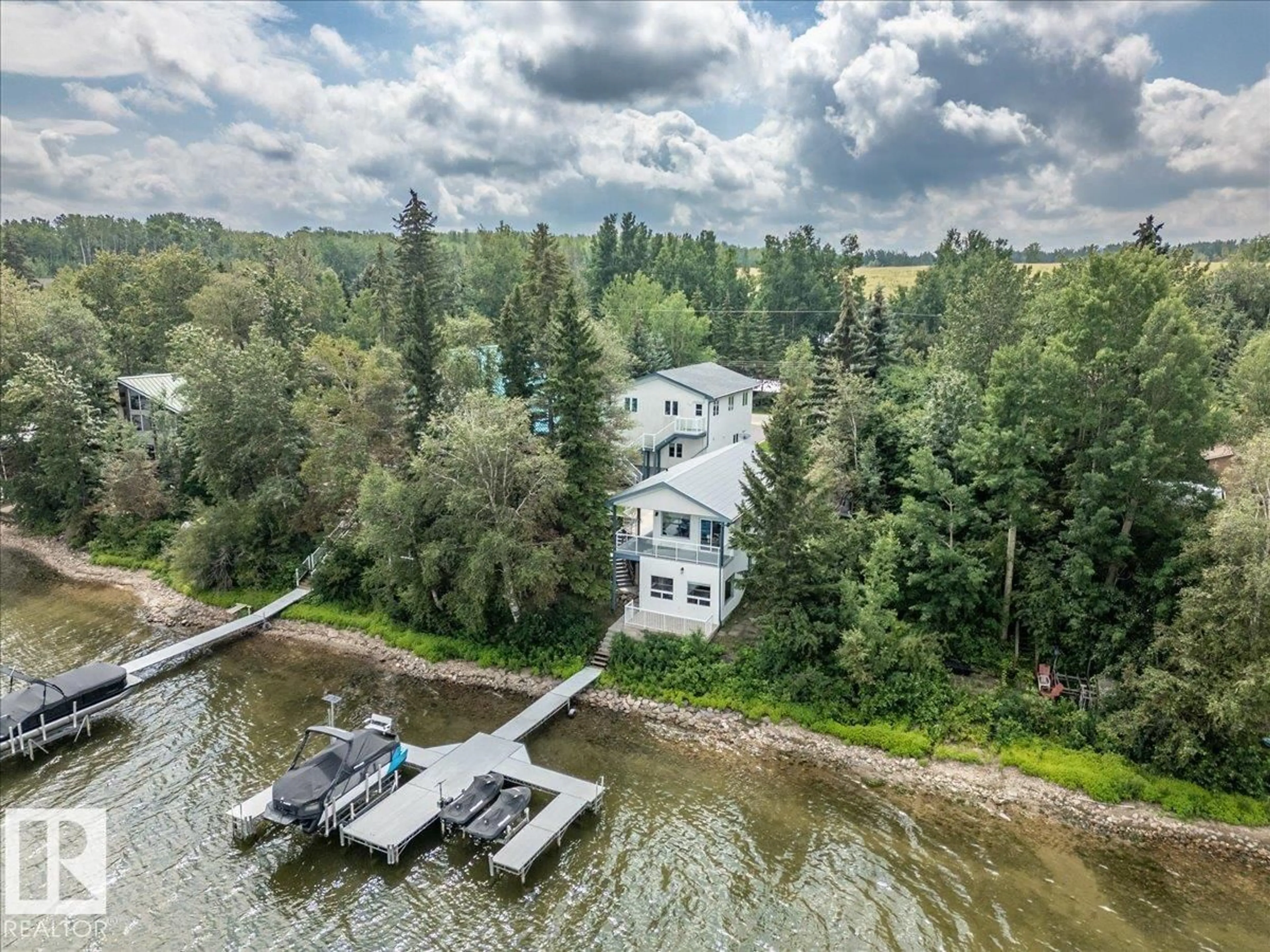 A pic from outside/outdoor area/front of a property/back of a property/a pic from drone, water/lake/river/ocean view for 239 LAKESHORE DR, Rural Wetaskiwin County Alberta T0C2V0