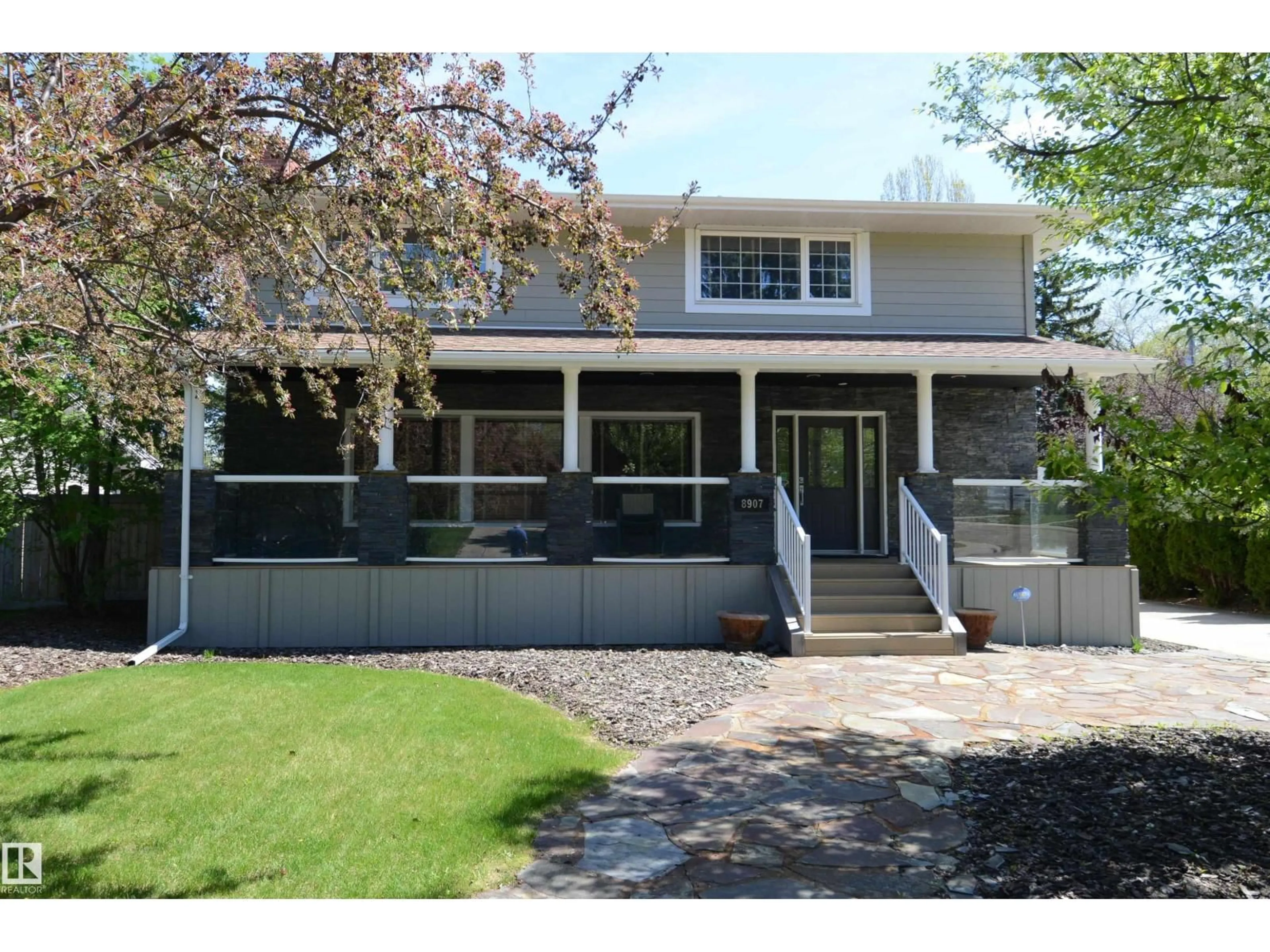 Home with vinyl exterior material, street for 8907 140 ST, Edmonton Alberta T5R0J1