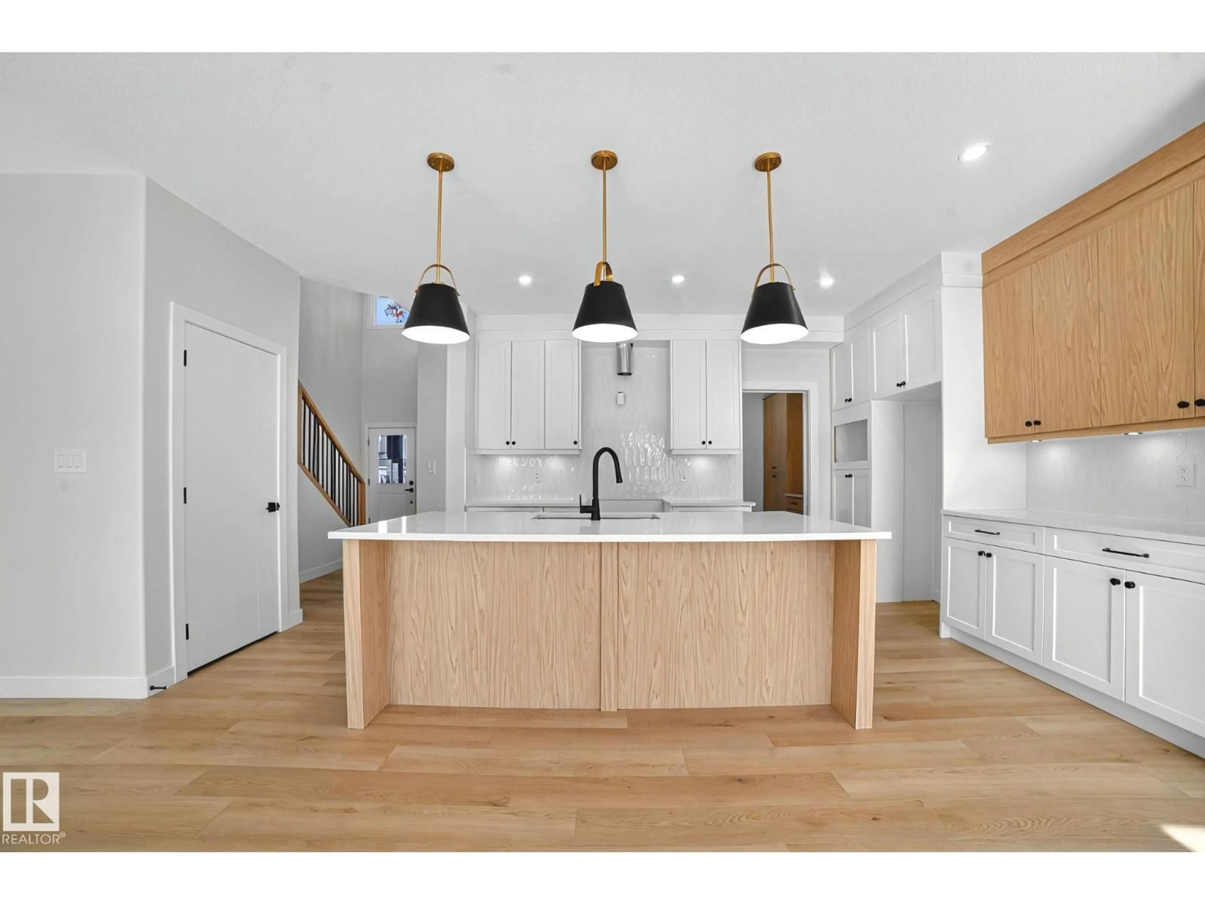 Open concept kitchen, wood/laminate floor for 523 ASHGROVE CIRCLE, Leduc Alberta T9E0K8