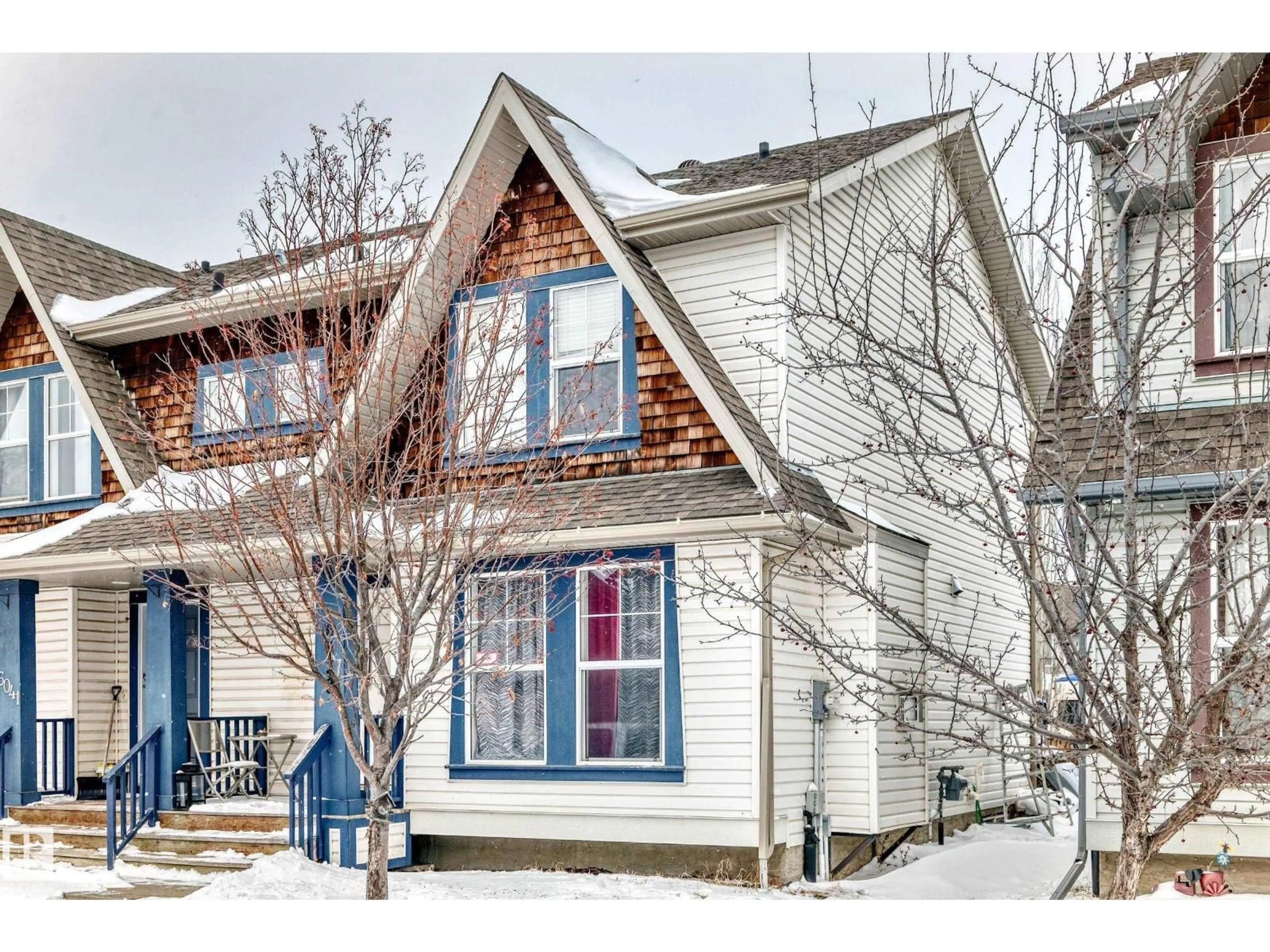 Home with vinyl exterior material, street for NW - 6039 214 ST, Edmonton Alberta T6M0K1