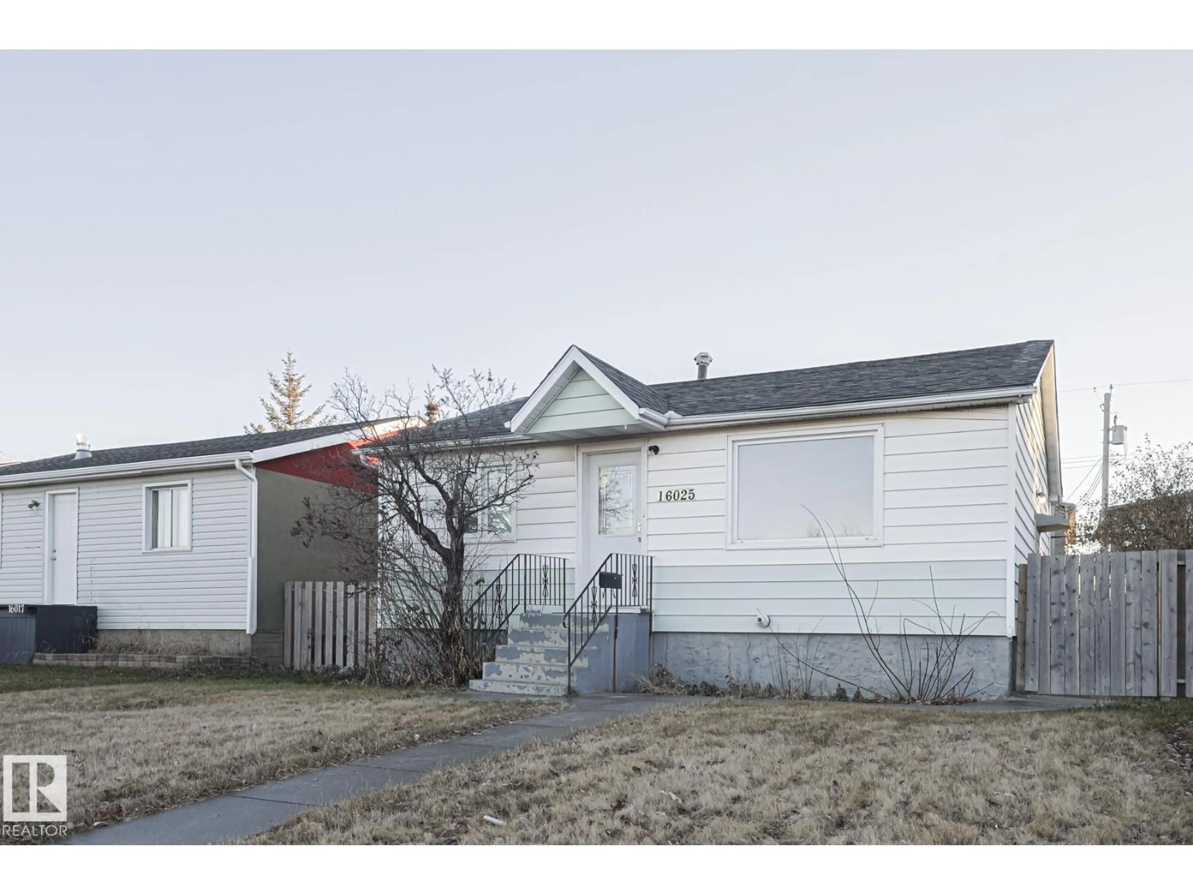 Home with vinyl exterior material, street for 16025 100A AV, Edmonton Alberta T5P0L9