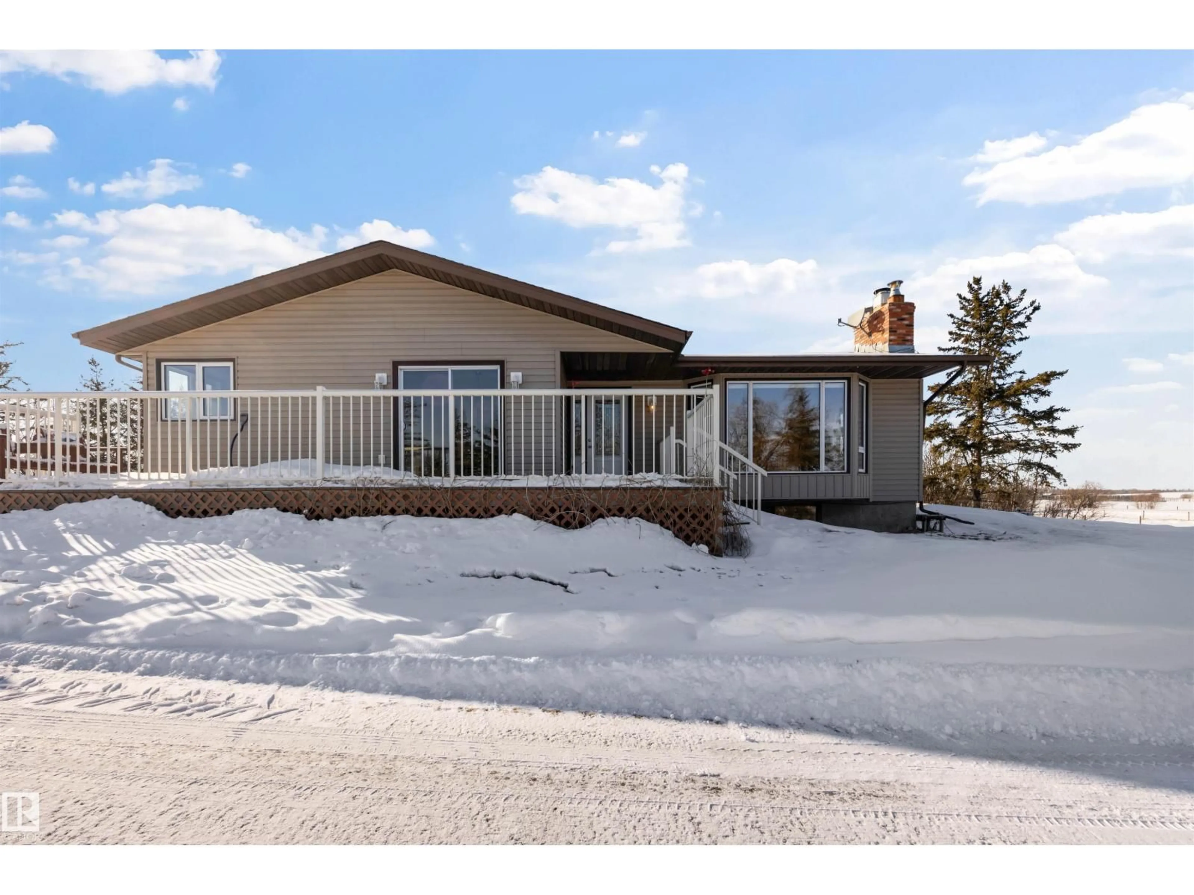 Home with vinyl exterior material, street for 22325 TOWNSHIP 502 NE, Rural Leduc County Alberta T0B3M2
