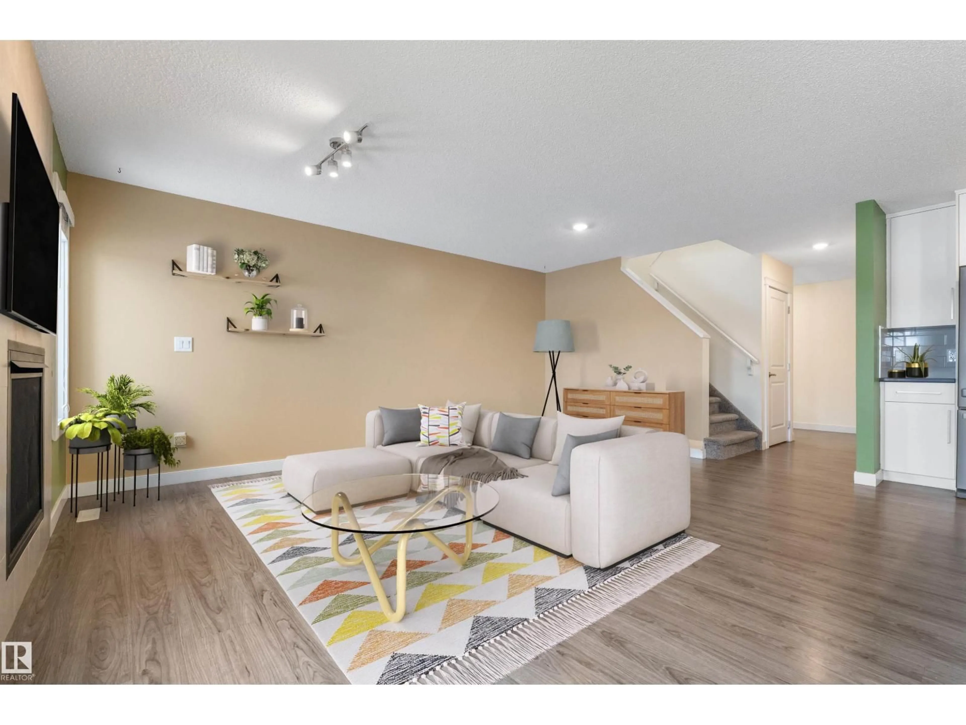 Living room with furniture, wood/laminate floor for 140 RADCLIFFE WD, Fort Saskatchewan Alberta T8L0S9