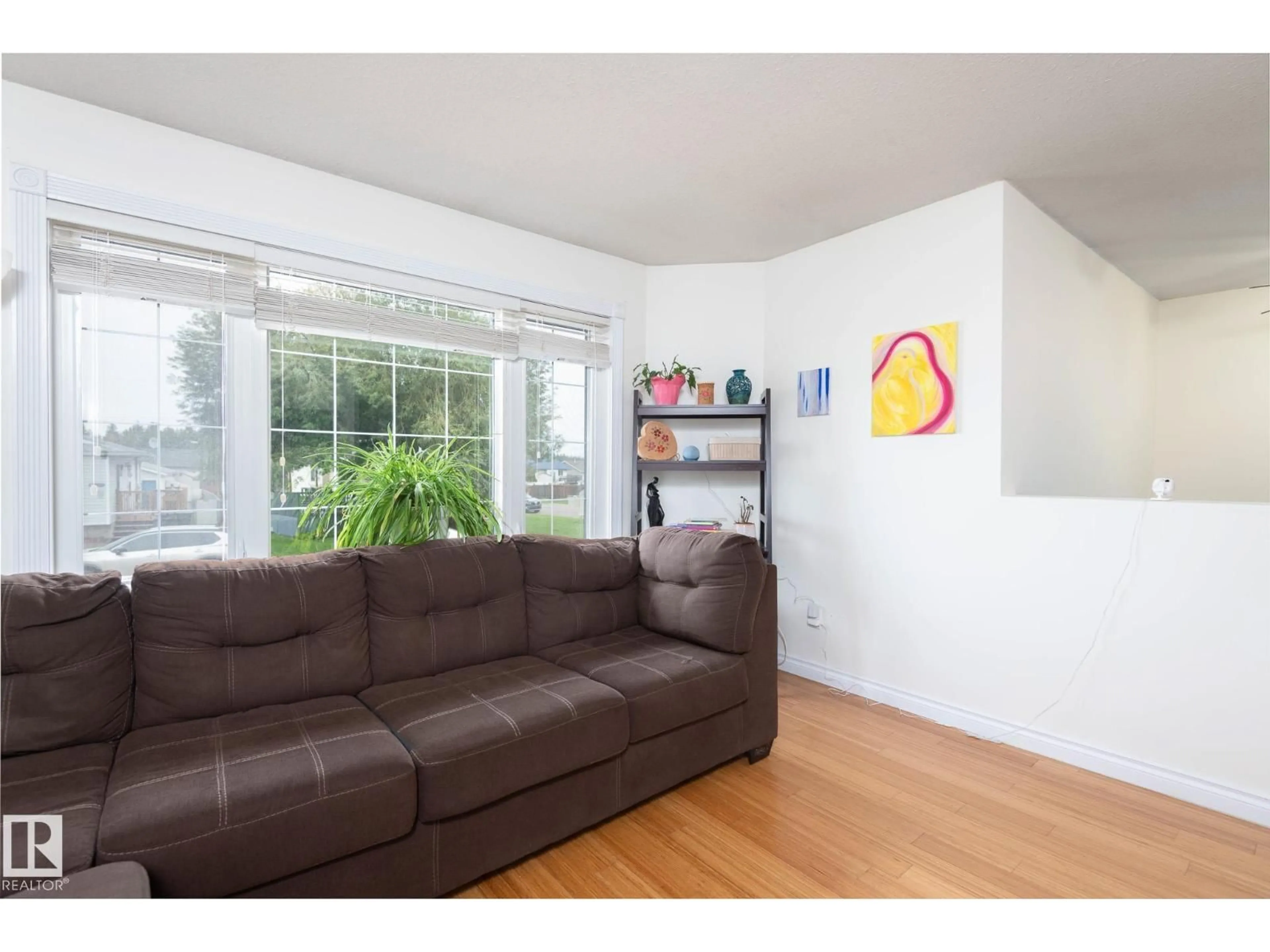 Living room with furniture, wood/laminate floor for 6103 53 AV, Cold Lake Alberta T9M1V5