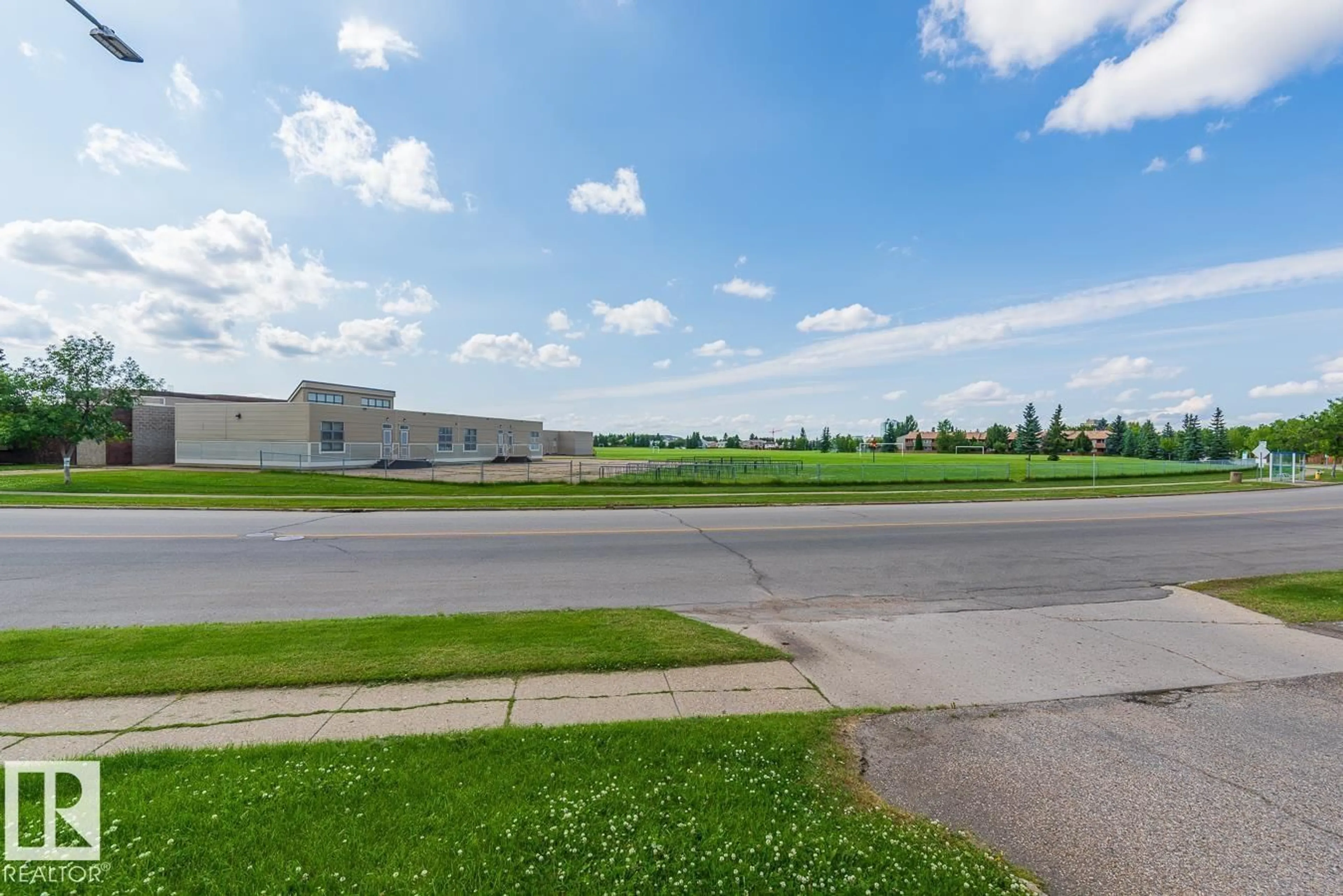 A pic from outside/outdoor area/front of a property/back of a property/a pic from drone, street for #417 - 1945 105 ST, Edmonton Alberta T6J5N6