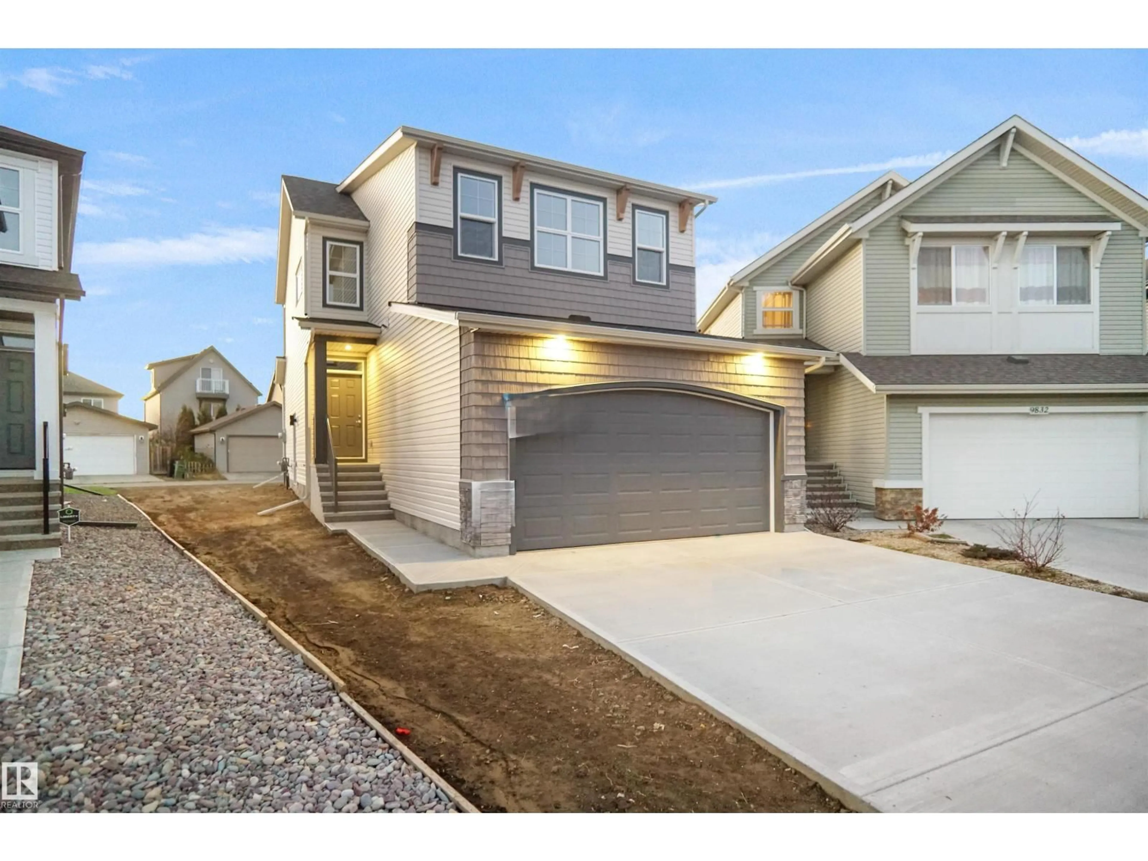 Home with vinyl exterior material, street for NW - 9828 219 ST, Edmonton Alberta T5T7A7