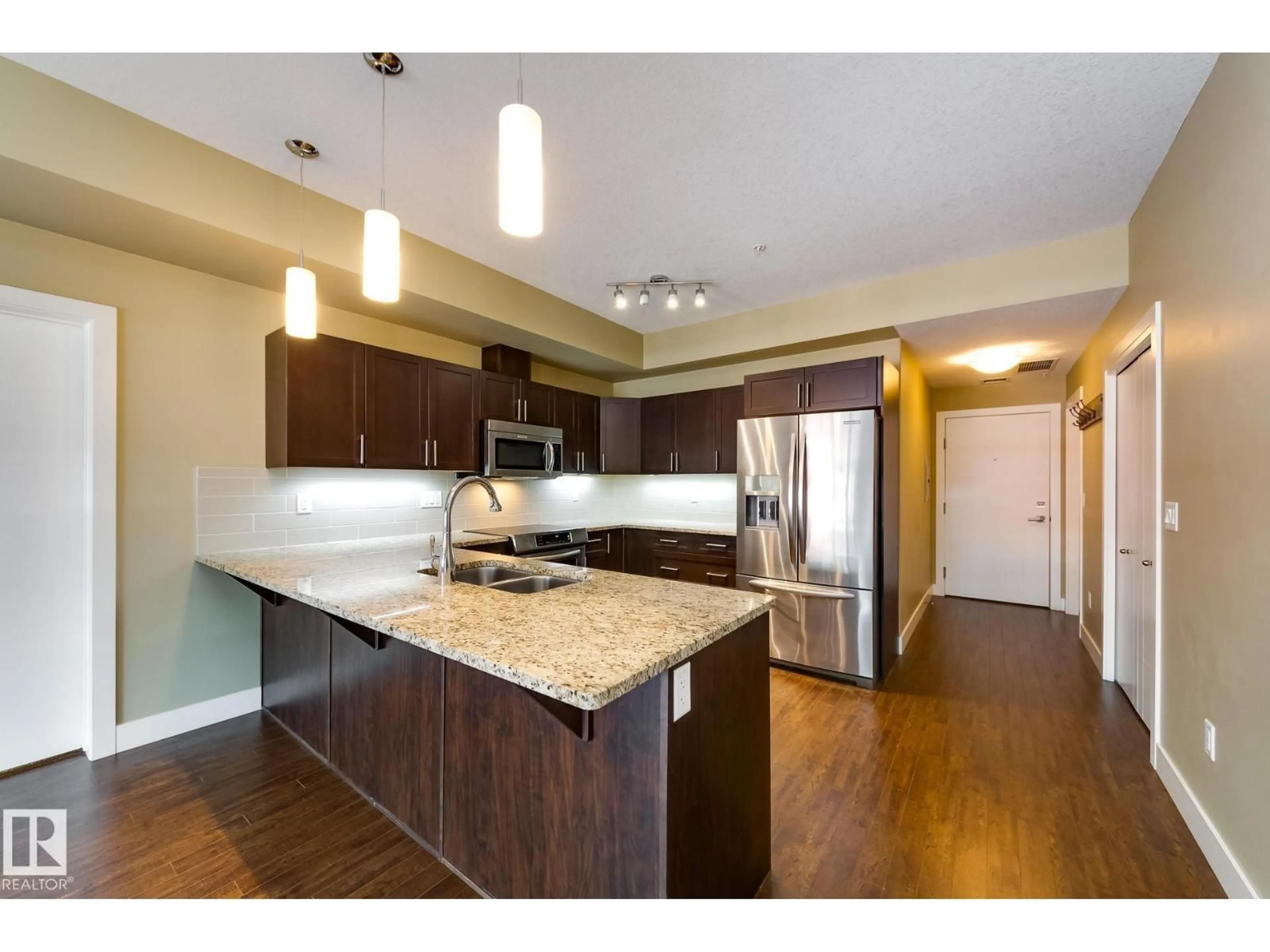 Open concept kitchen, wood/laminate floor for 111 - 207 FESTIVAL WY, Sherwood Park Alberta T8A4Y4