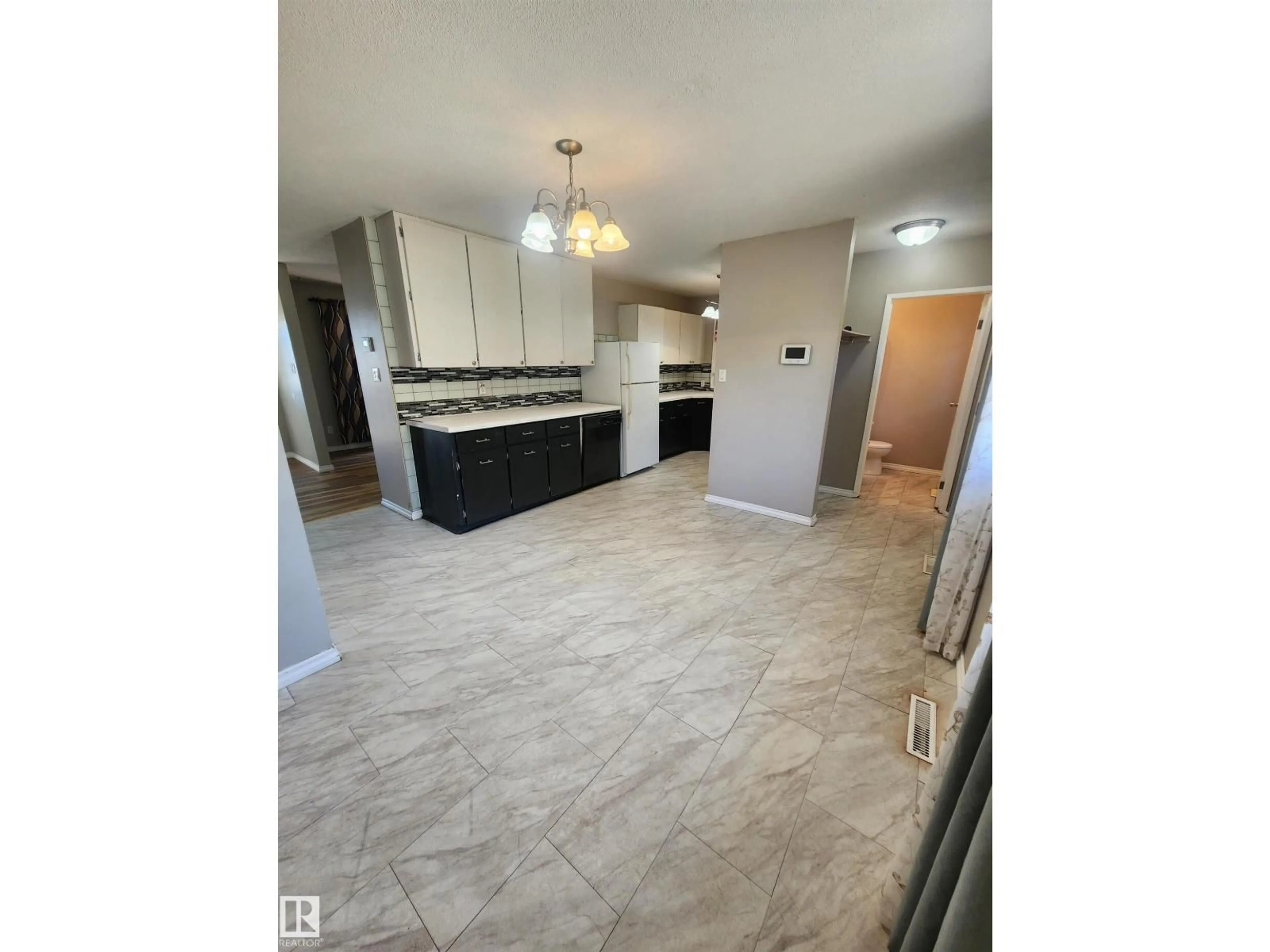 Open concept kitchen, ceramic/tile floor for 5114 52 ST, Bonnyville Town Alberta T9N2B2