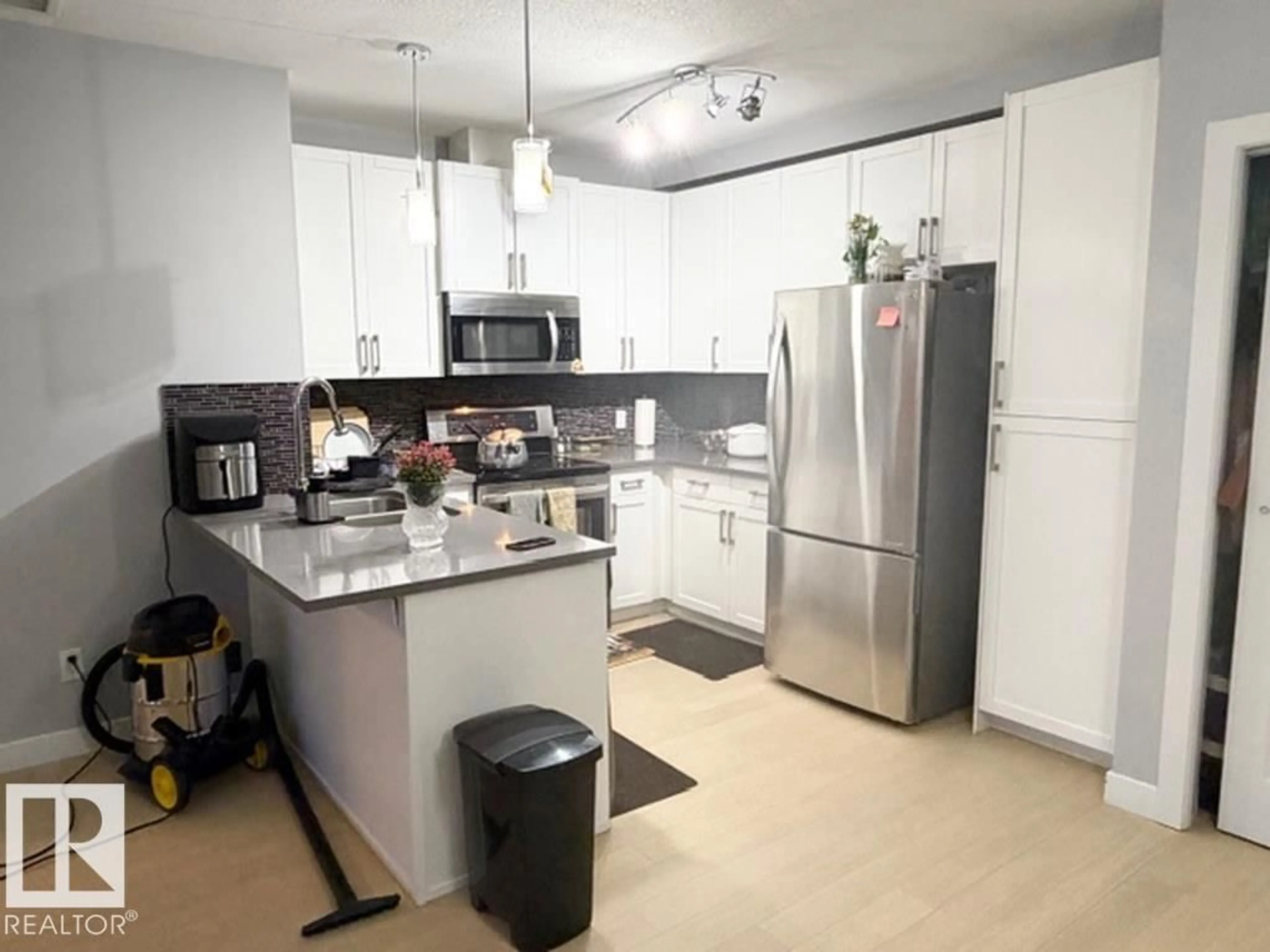 Open concept kitchen, ceramic/tile floor for 706 - 5151 WINDERMERE BV, Edmonton Alberta T6W2K4