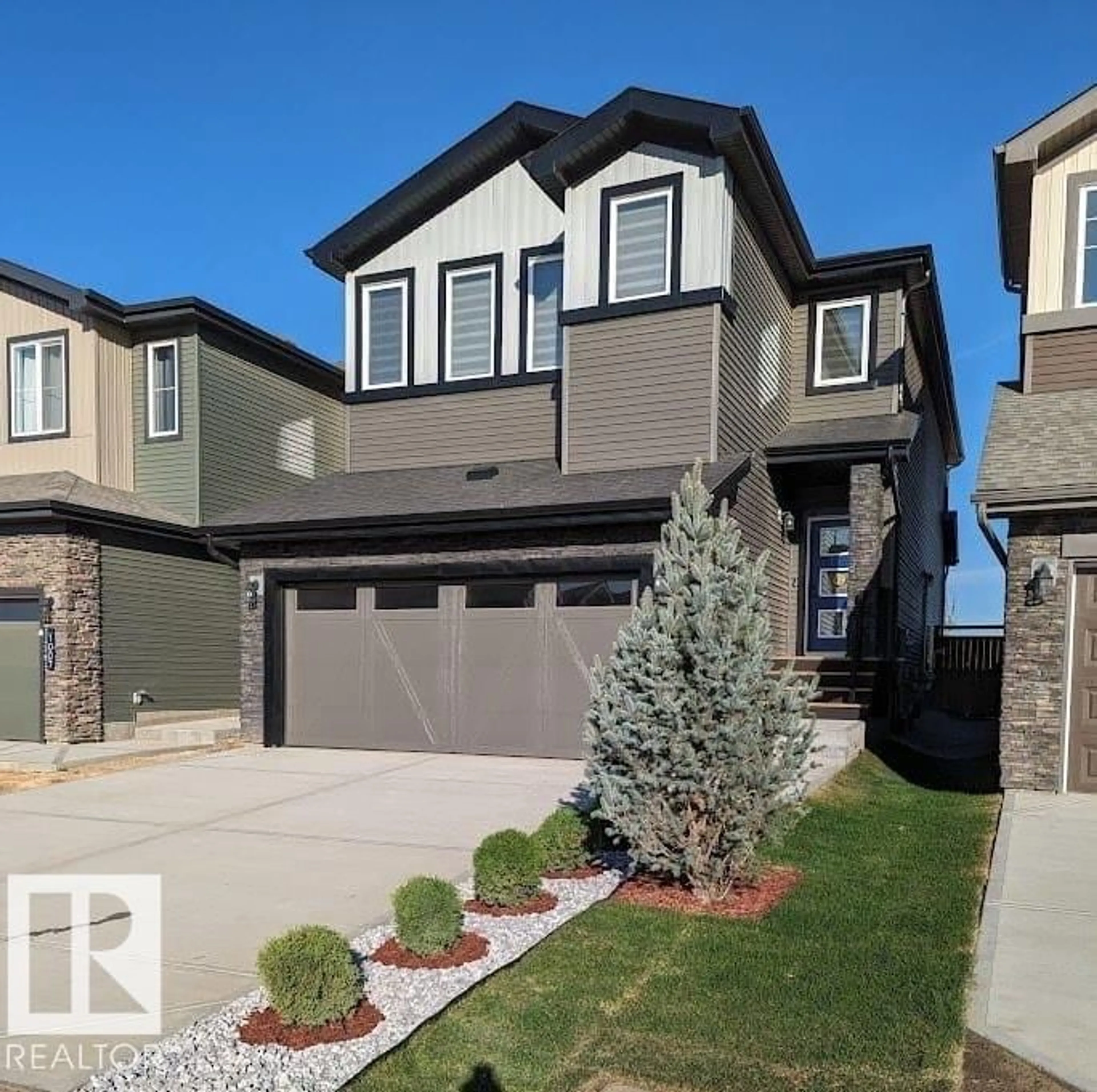 Home with vinyl exterior material, street for 1009 GOLDFINCH WY, Edmonton Alberta T5S0P9