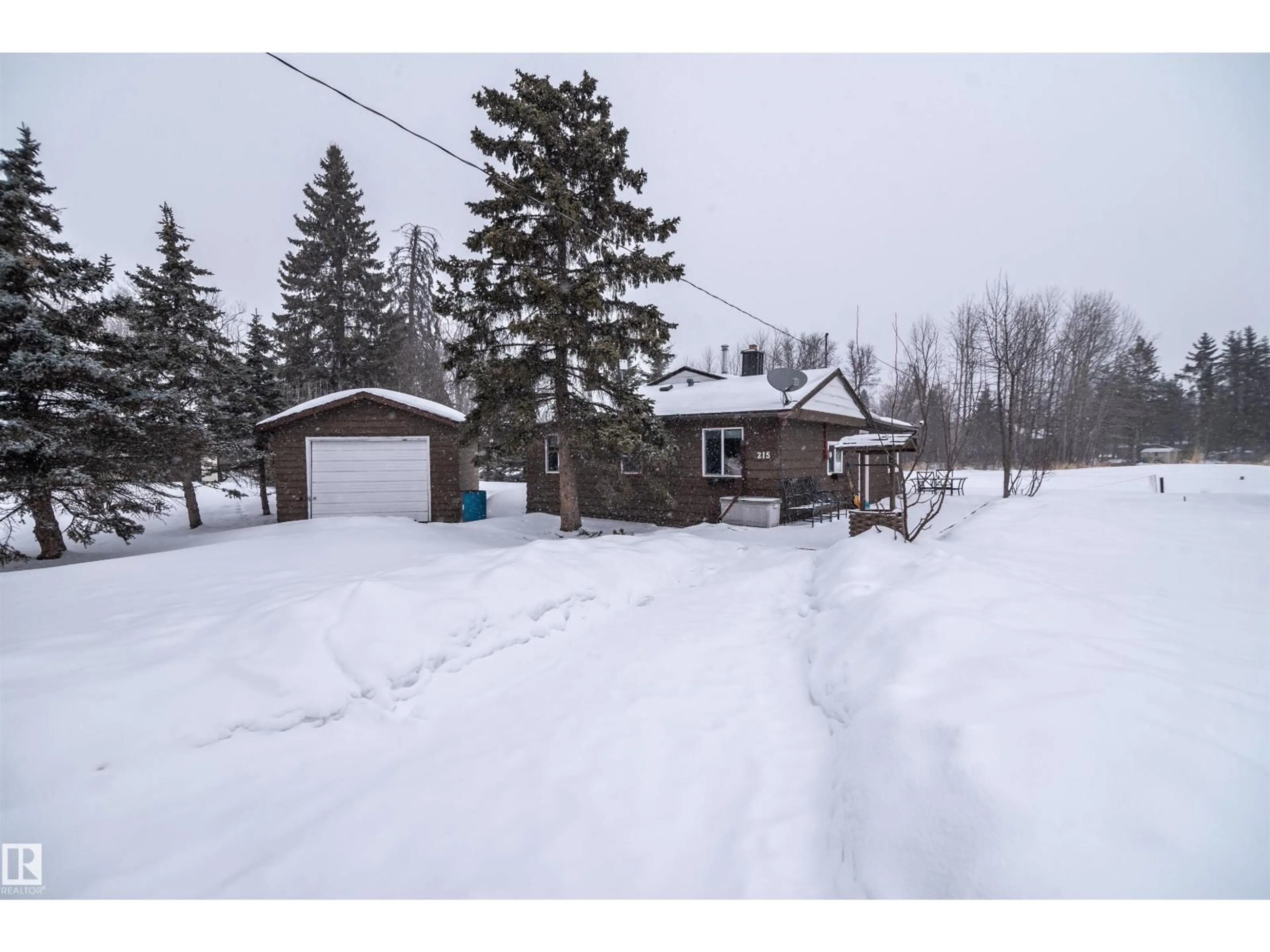 A pic from outside/outdoor area/front of a property/back of a property/a pic from drone, street for 215 2 ST, Rural Lac Ste. Anne County Alberta T0E1A0