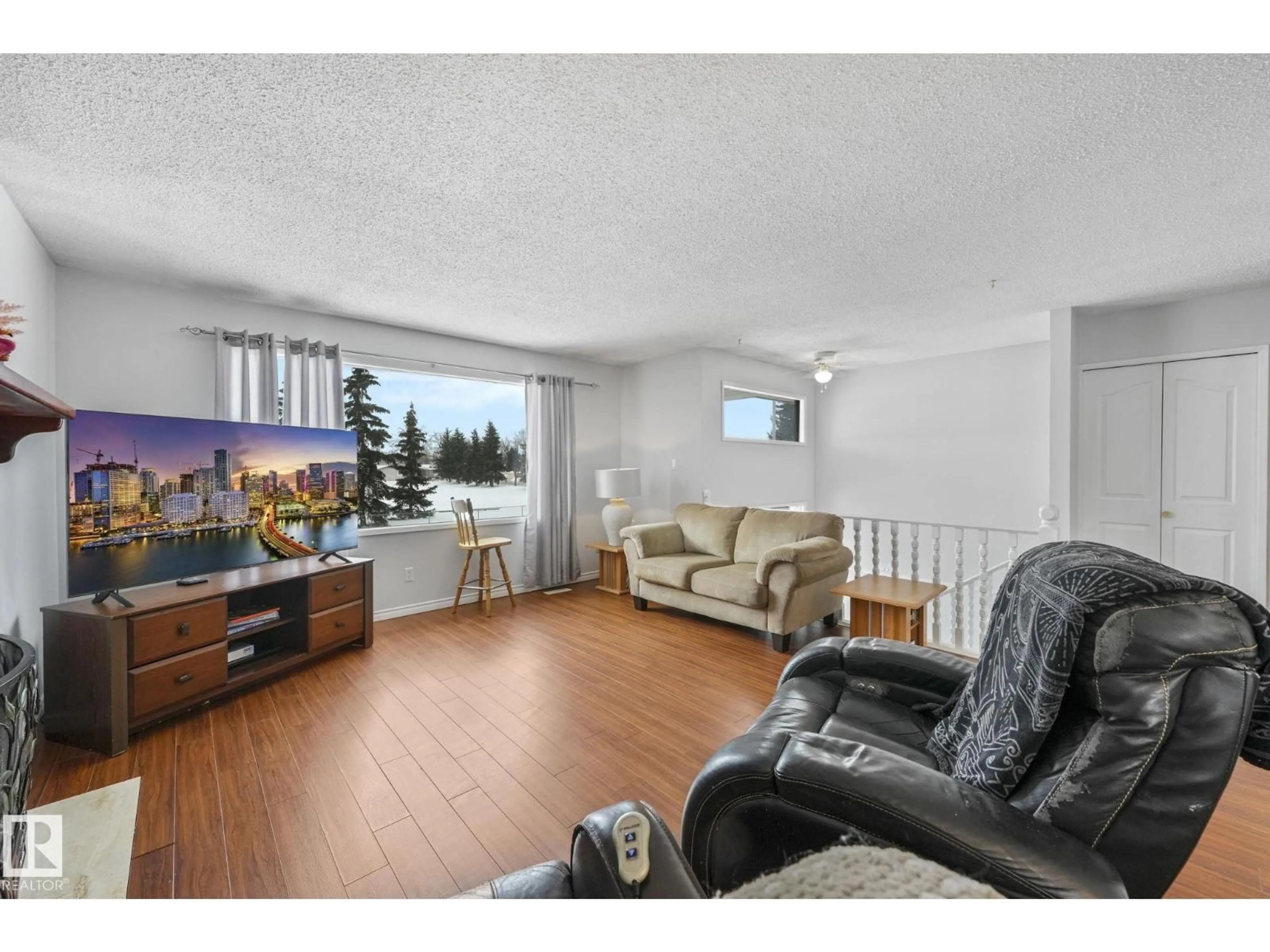 Living room with furniture, wood/laminate floor for 1162 PARKER MR, Sherwood Park Alberta T8A3Z2