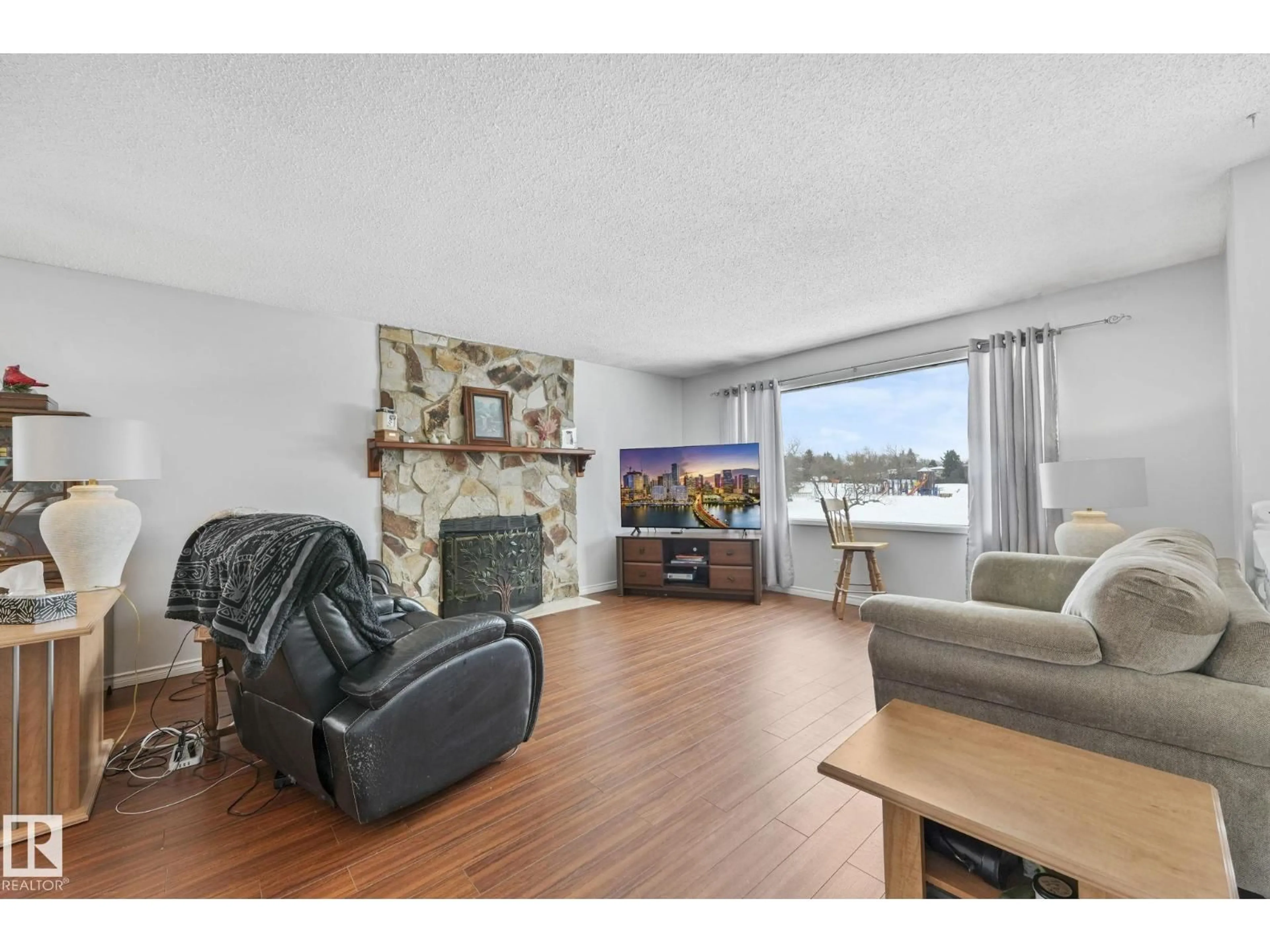 Living room with furniture, wood/laminate floor for 1162 PARKER MR, Sherwood Park Alberta T8A3Z2