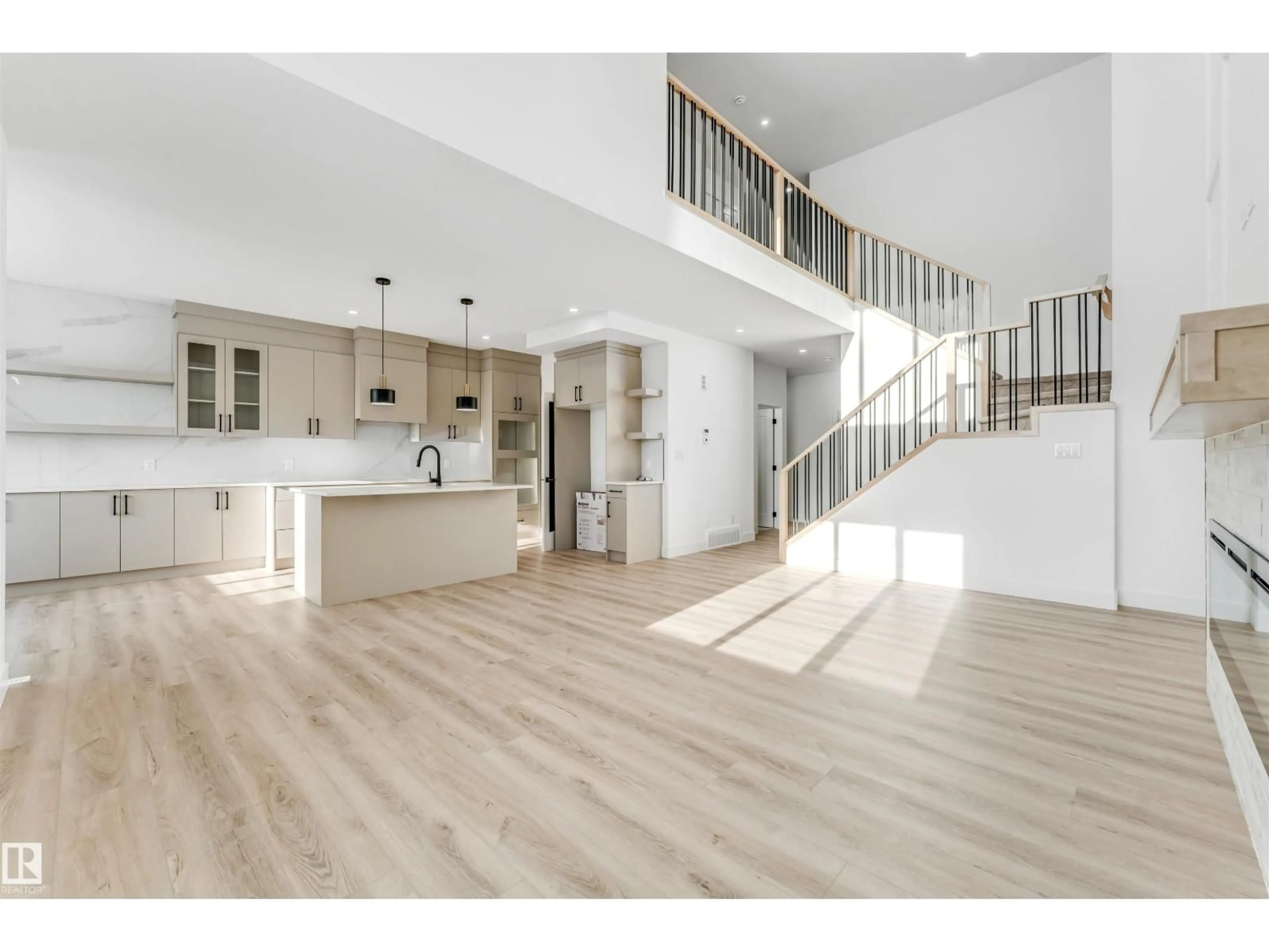 Open concept kitchen, wood/laminate floor for 4102 67 STREET, Beaumont Alberta T4X3E9