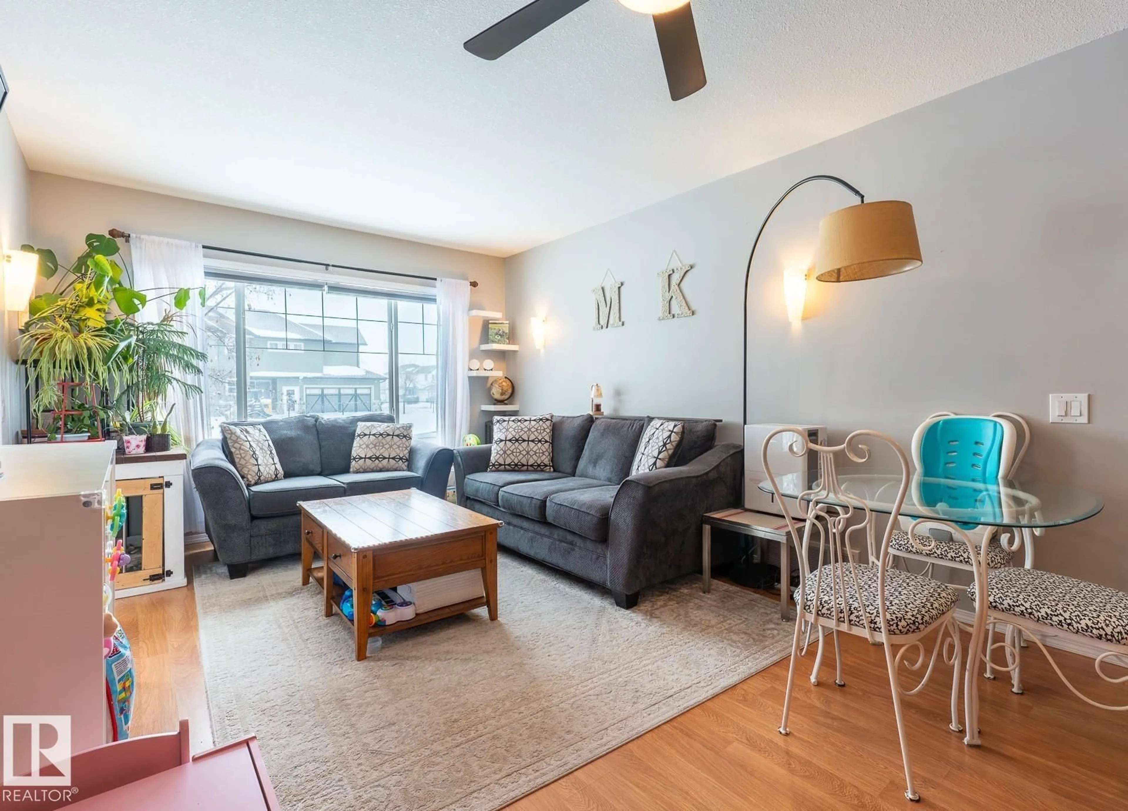 Living room with furniture, wood/laminate floor for 671 - 9 SILVER BERRY RD, Edmonton Alberta T6T0B7