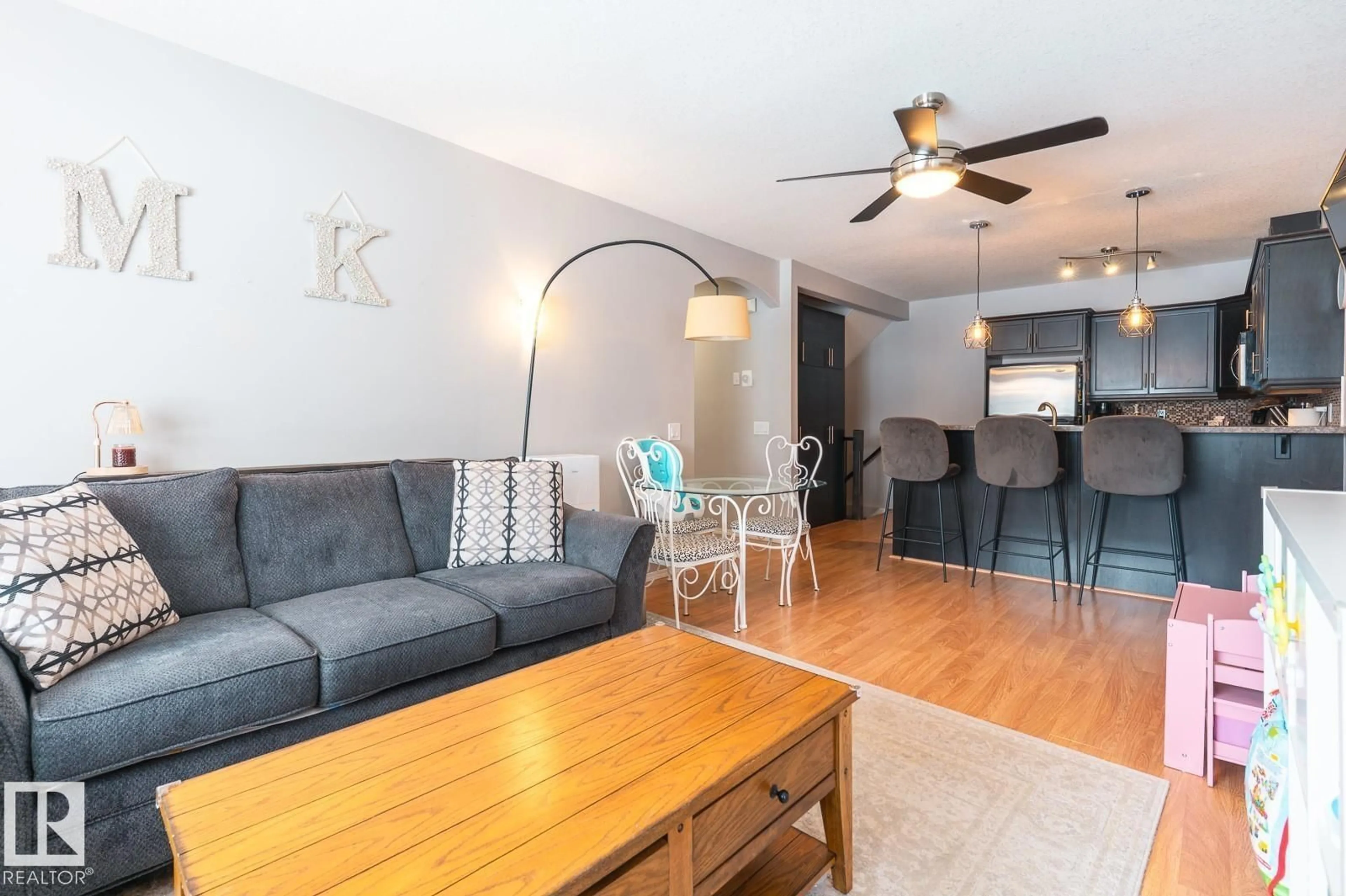 Living room with furniture, wood/laminate floor for 671 - 9 SILVER BERRY RD, Edmonton Alberta T6T0B7