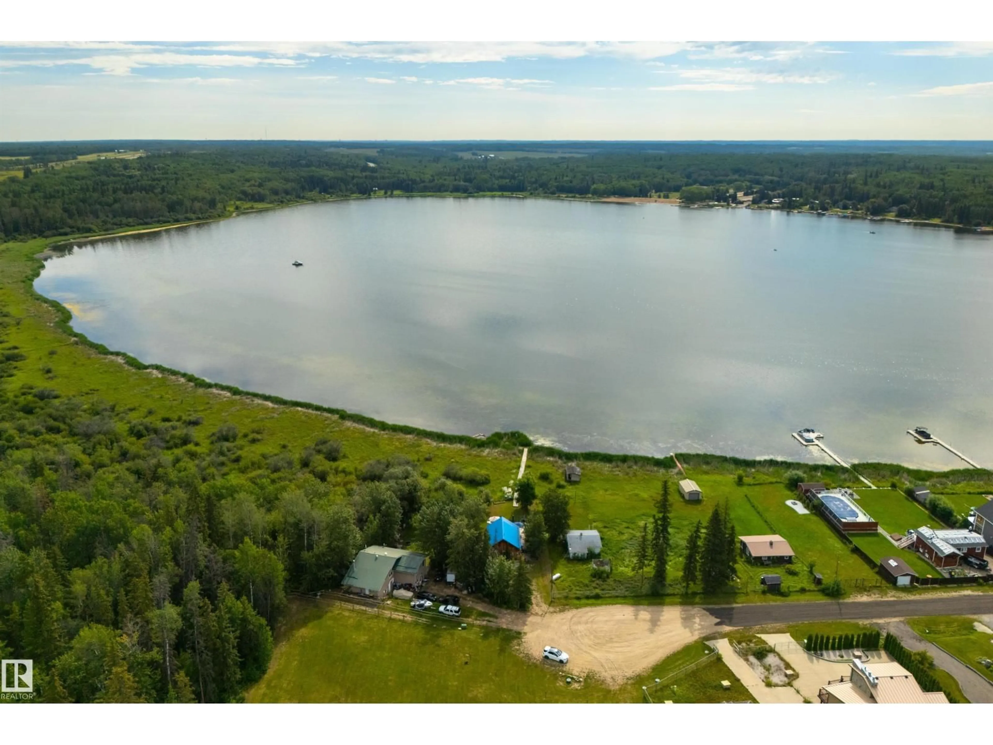 A pic from outside/outdoor area/front of a property/back of a property/a pic from drone, water/lake/river/ocean view for 113 BAYVIEW DR, Rural Parkland County Alberta T0E2K0