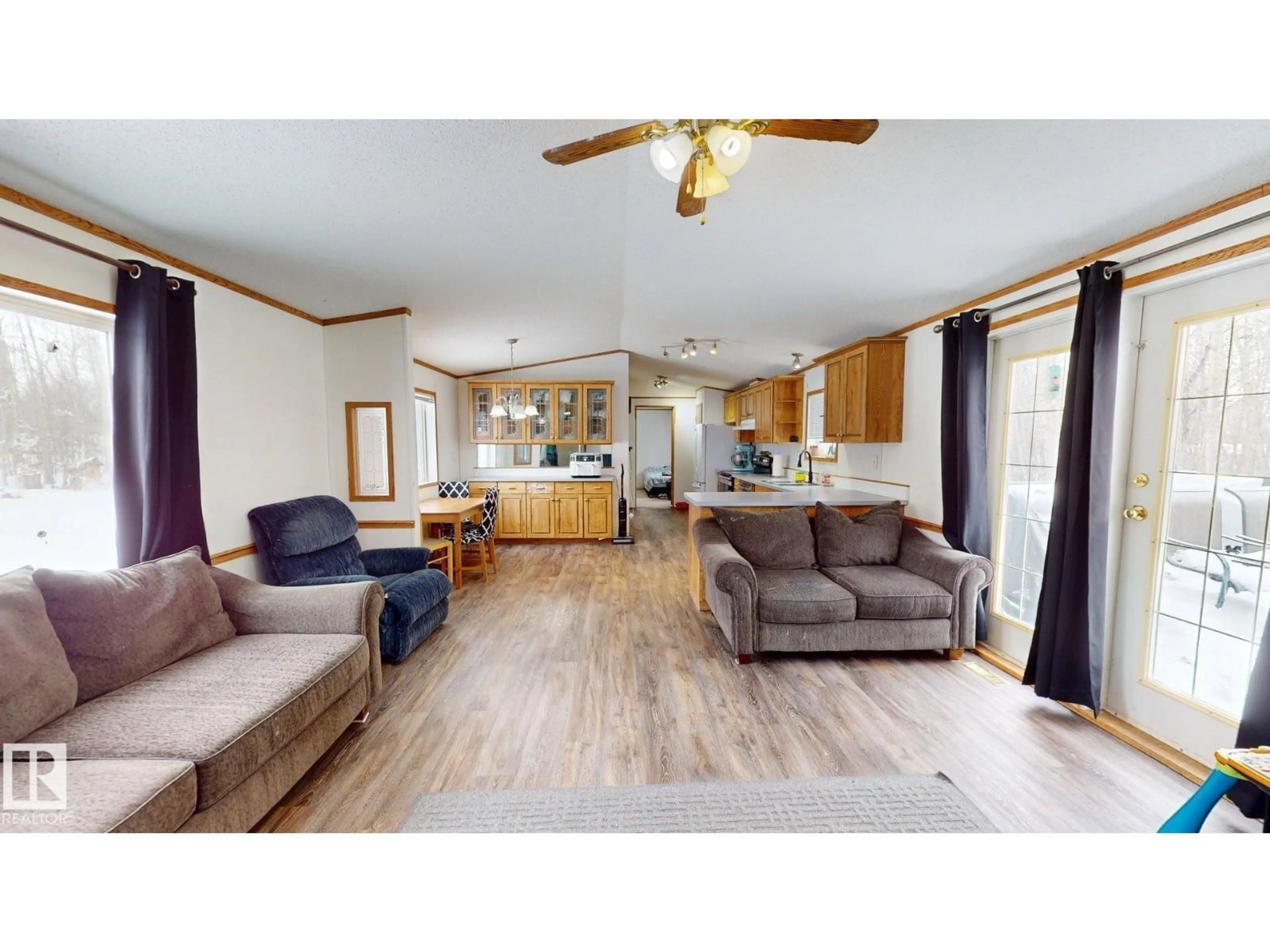 Living room with furniture, wood/laminate floor for 50403 RANGE ROAD 73, Rural Brazeau County Alberta T7A2A2