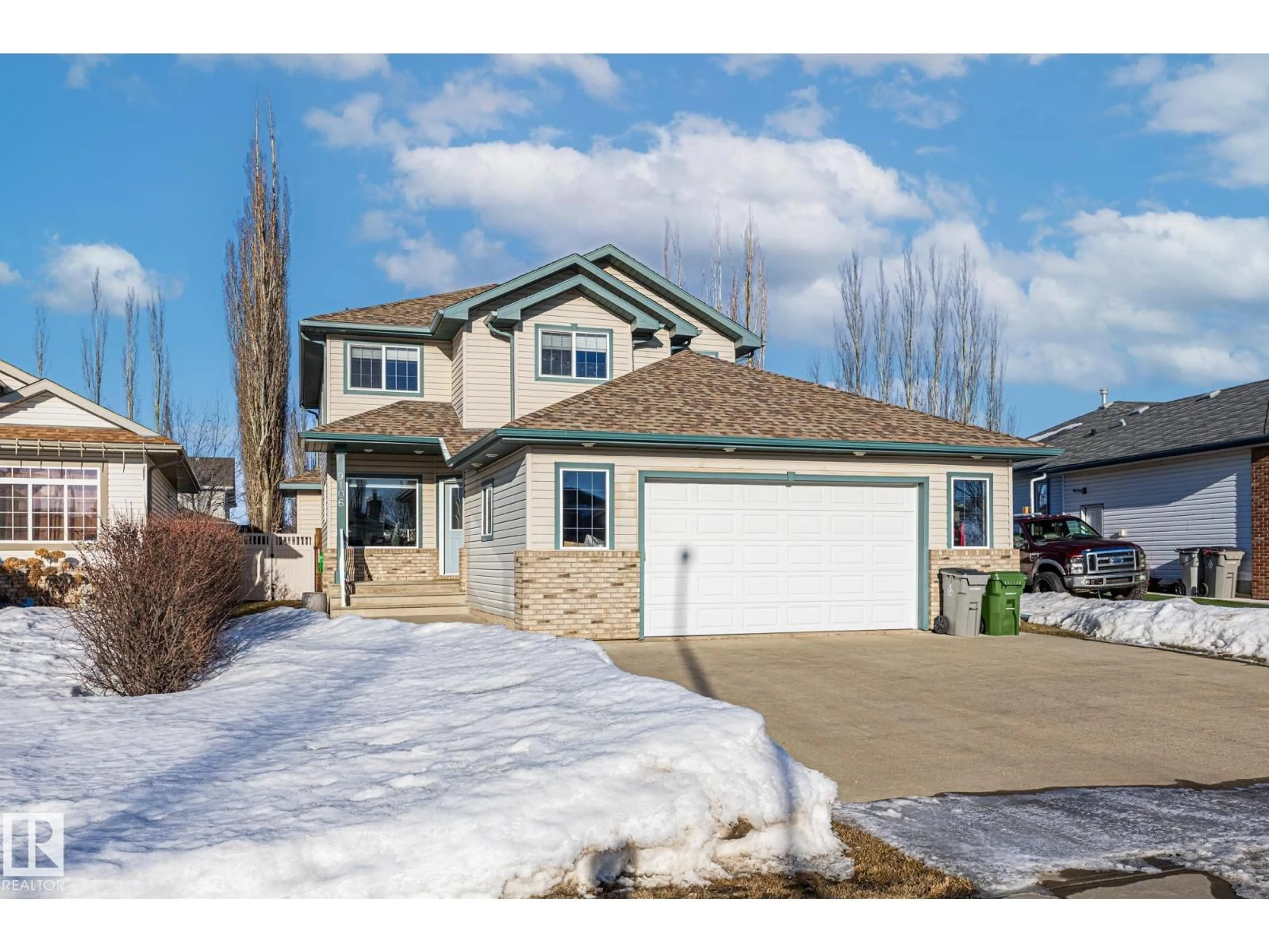 Home with vinyl exterior material, street for 9106 96 AV, Morinville Alberta T8R1T3