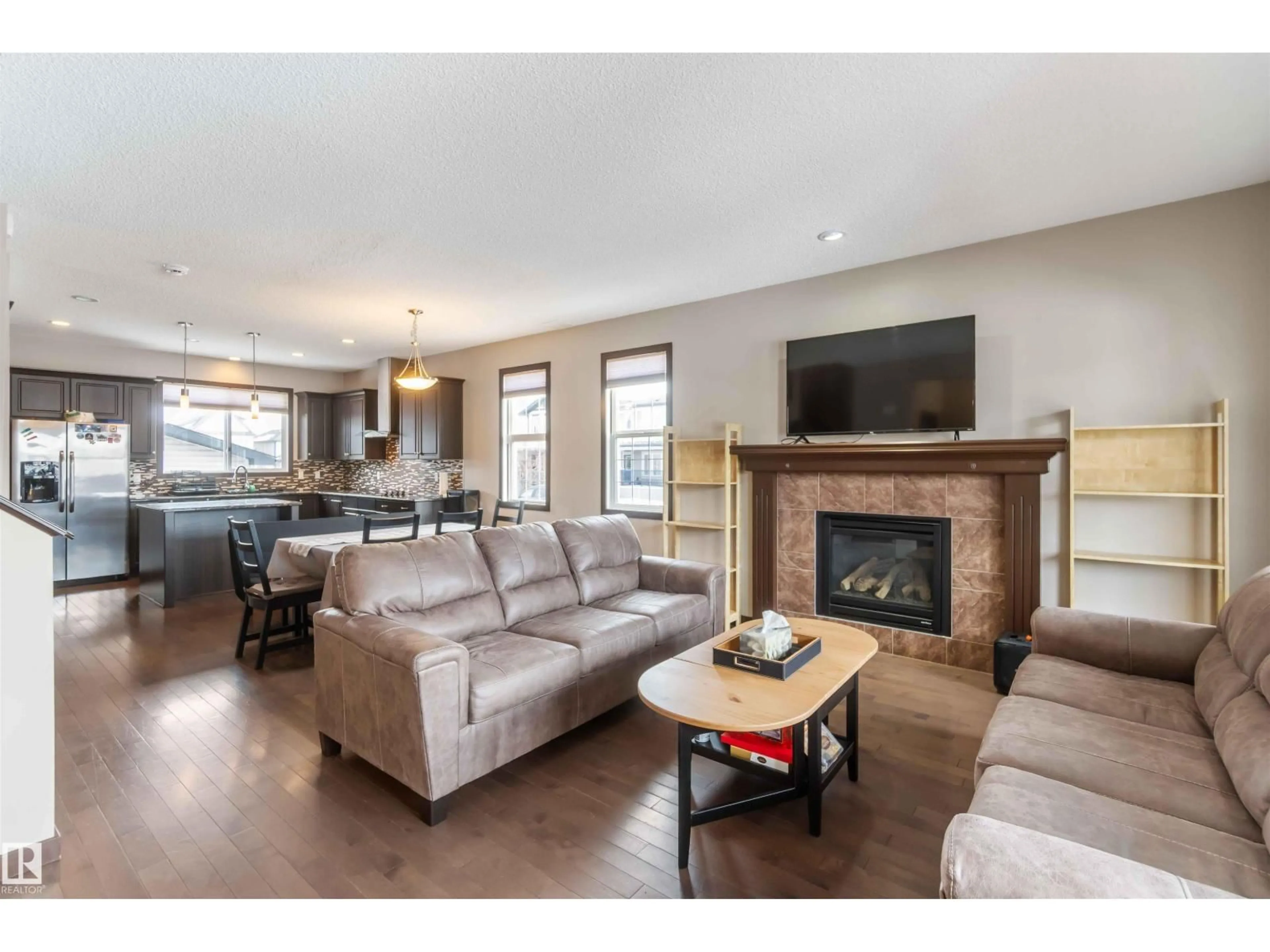 Living room with furniture, wood/laminate floor for NW - 9839 221 ST, Edmonton Alberta T5T4M3