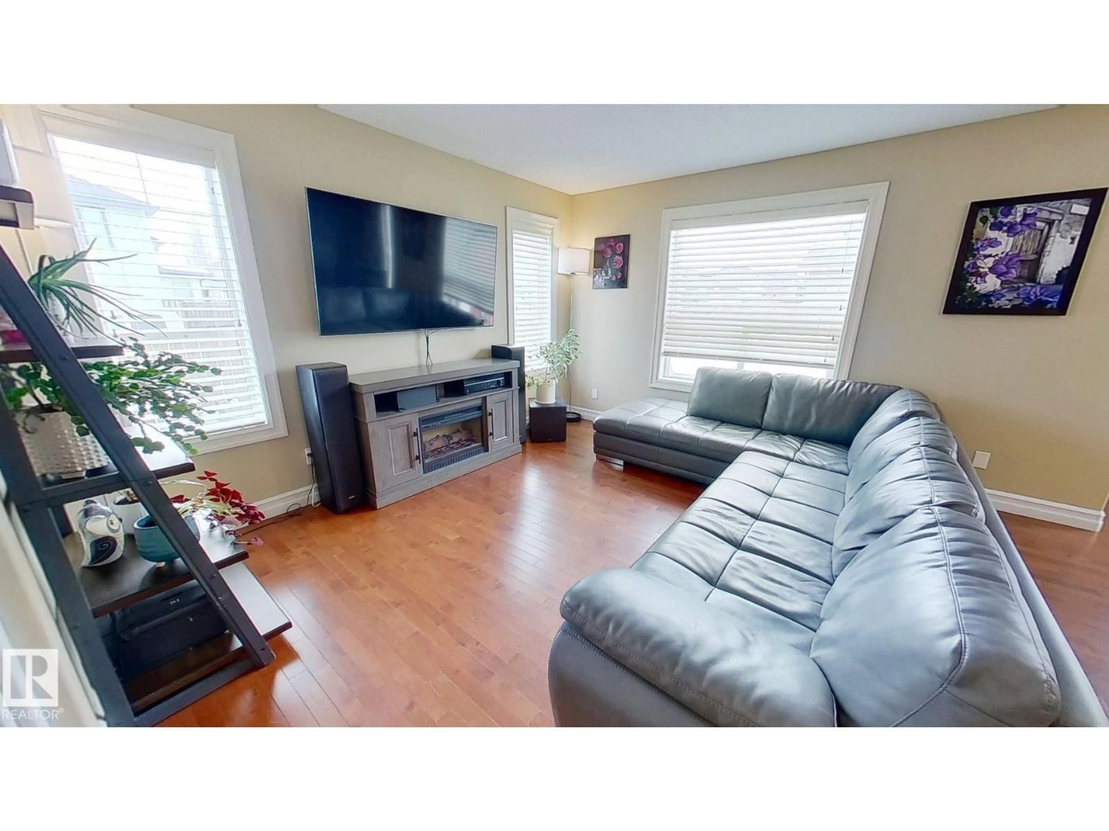 Living room with furniture, wood/laminate floor for 503 FOXTAIL GV, Sherwood Park Alberta T8A4G1